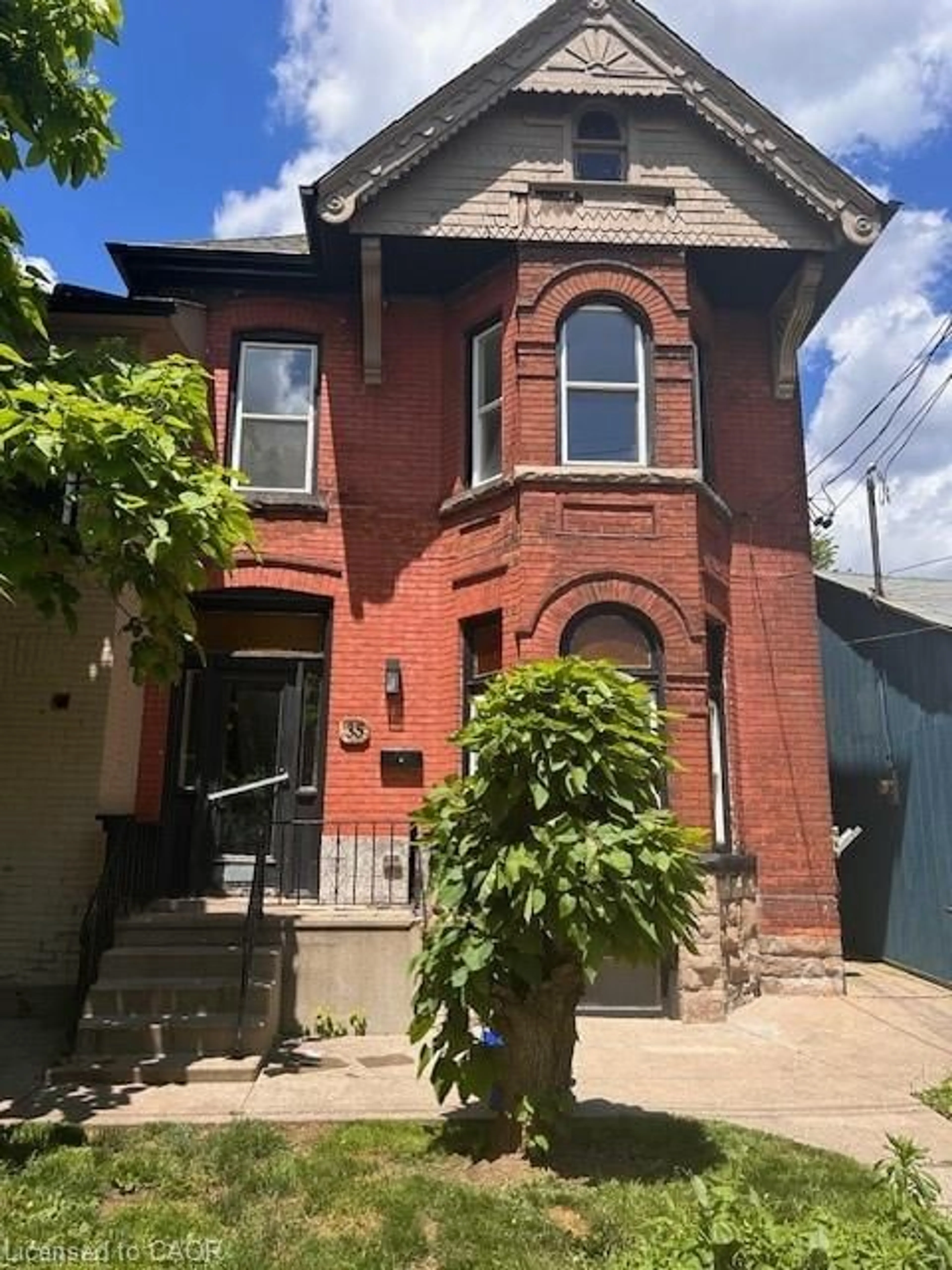 Home with brick exterior material, street for 33-35 Wood St, Hamilton Ontario L8L 3Y2