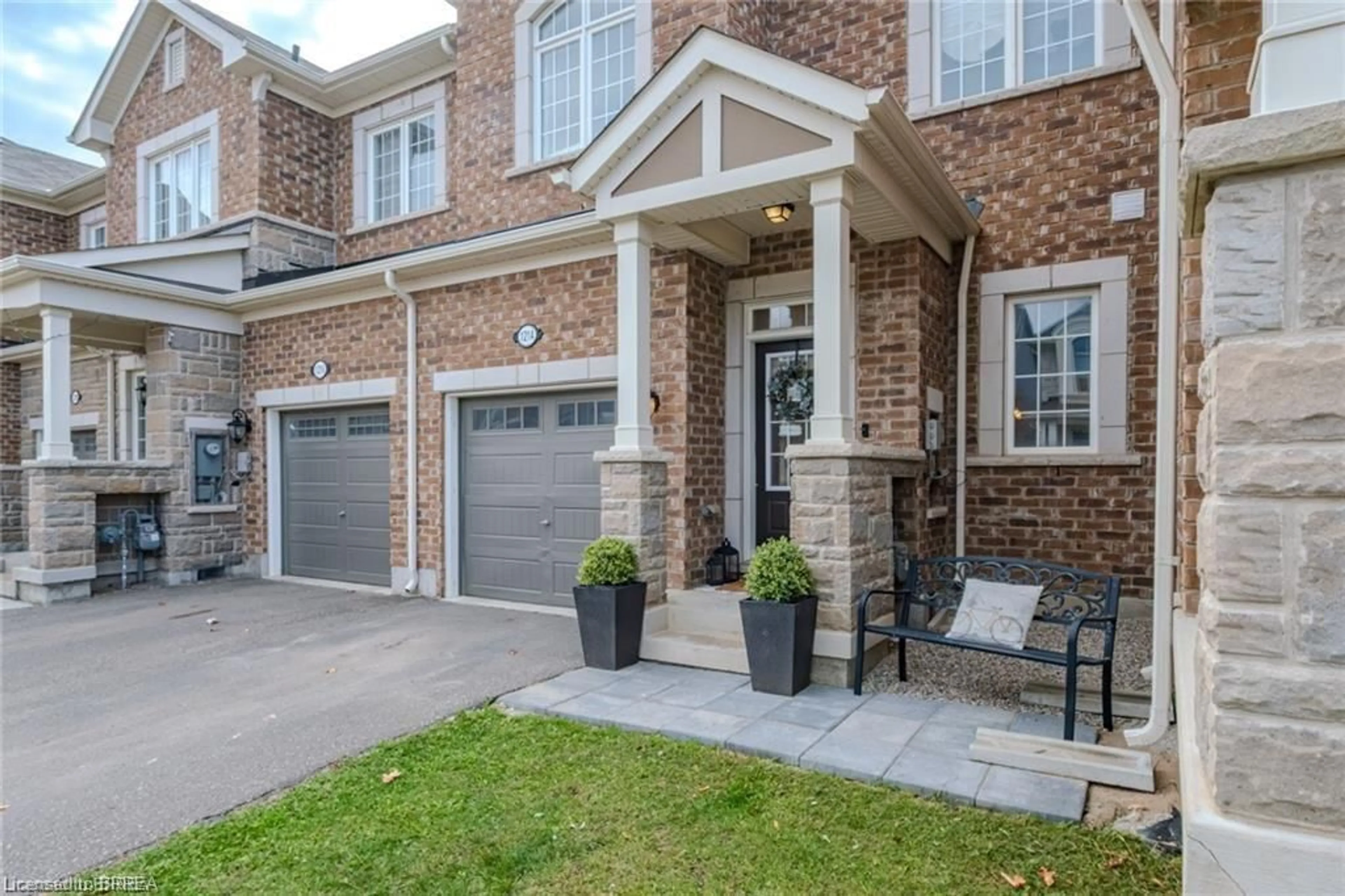 Home with brick exterior material, street for 1214 Rose Way, Milton Ontario L9E 1L9