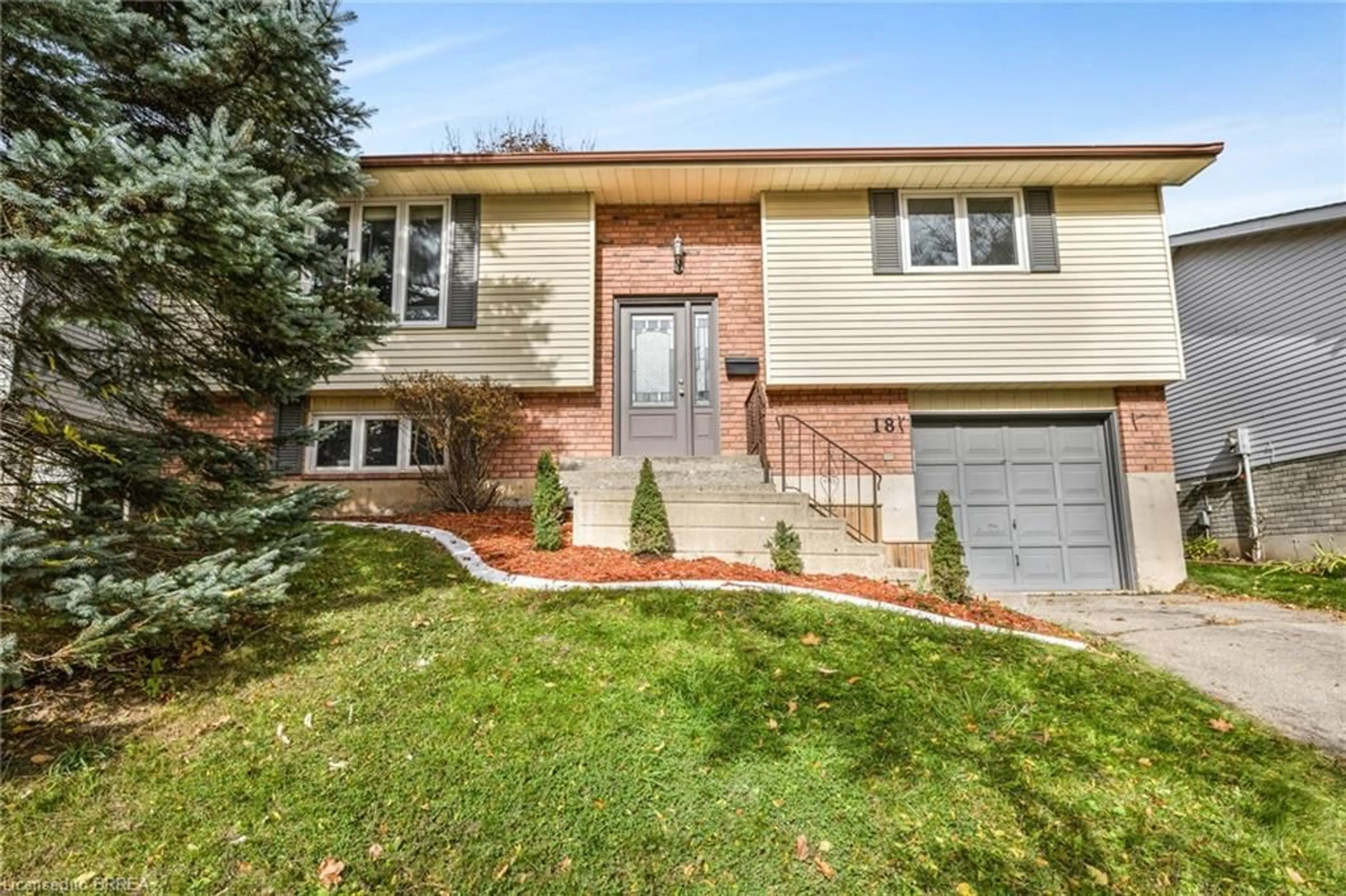 Home with brick exterior material, street for 18 Sandlewood Ave, Brantford Ontario N3V 1C6