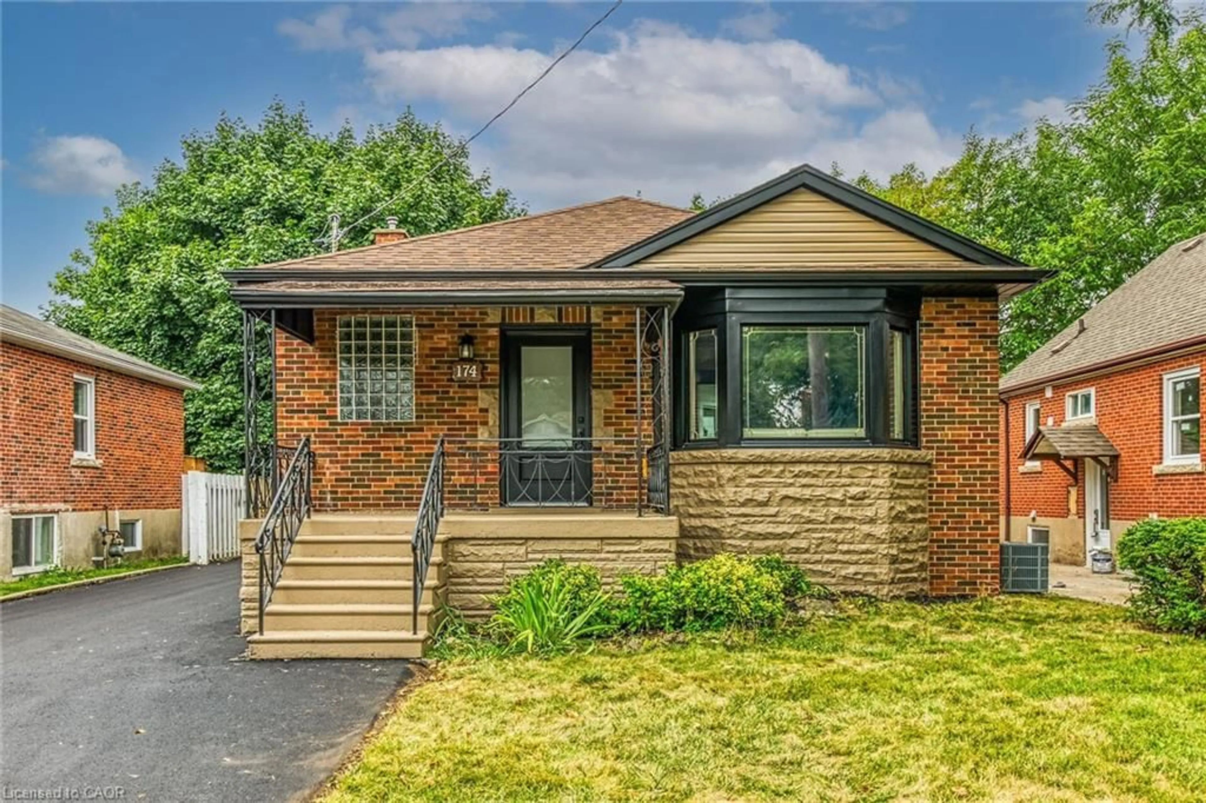Home with brick exterior material, street for 174 East 34th St, Hamilton Ontario L8V 3W6