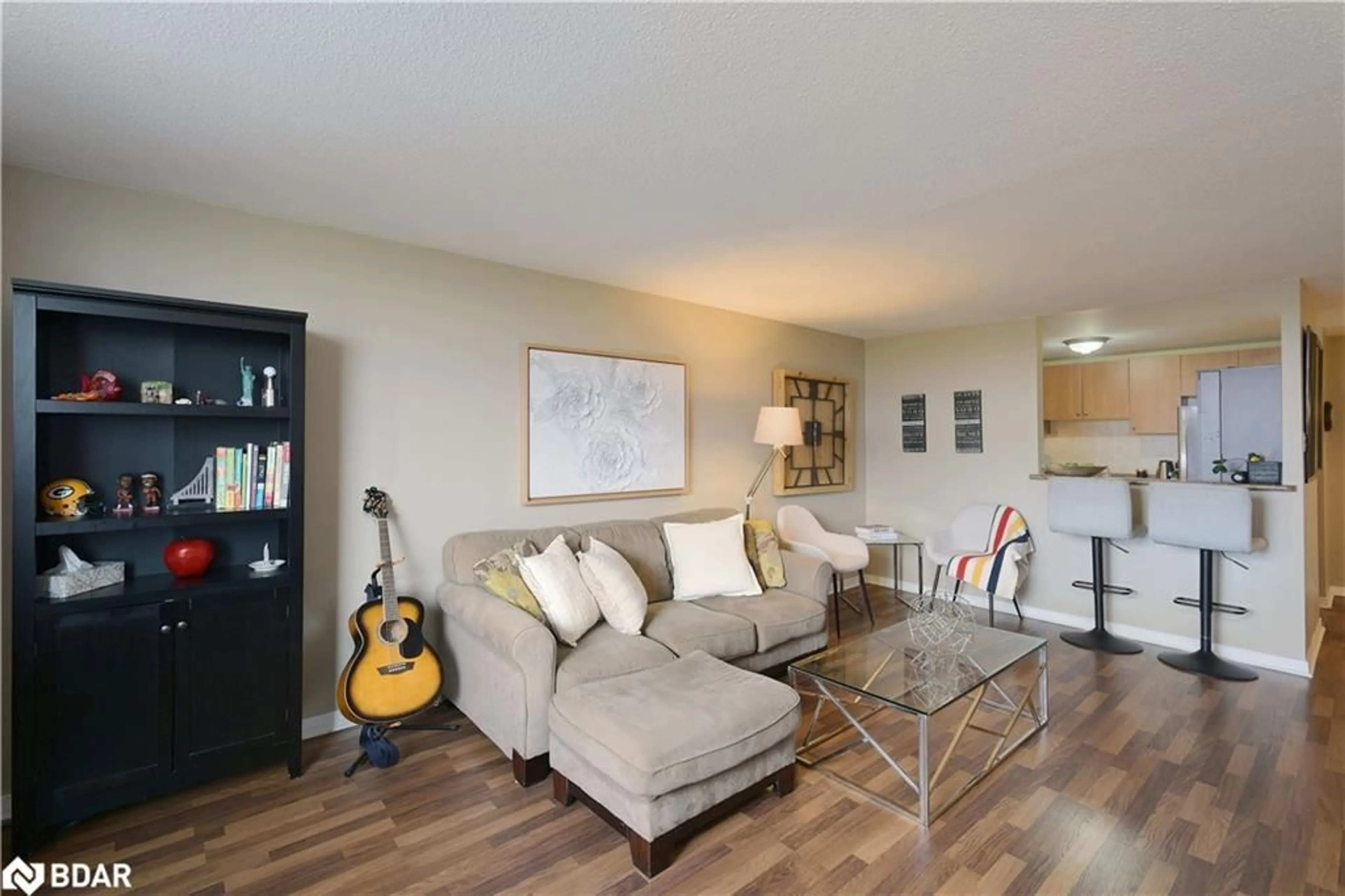 Living room with furniture, wood/laminate floor for 6720 Glen Erin Dr #501, Mississauga Ontario L5N 3K8