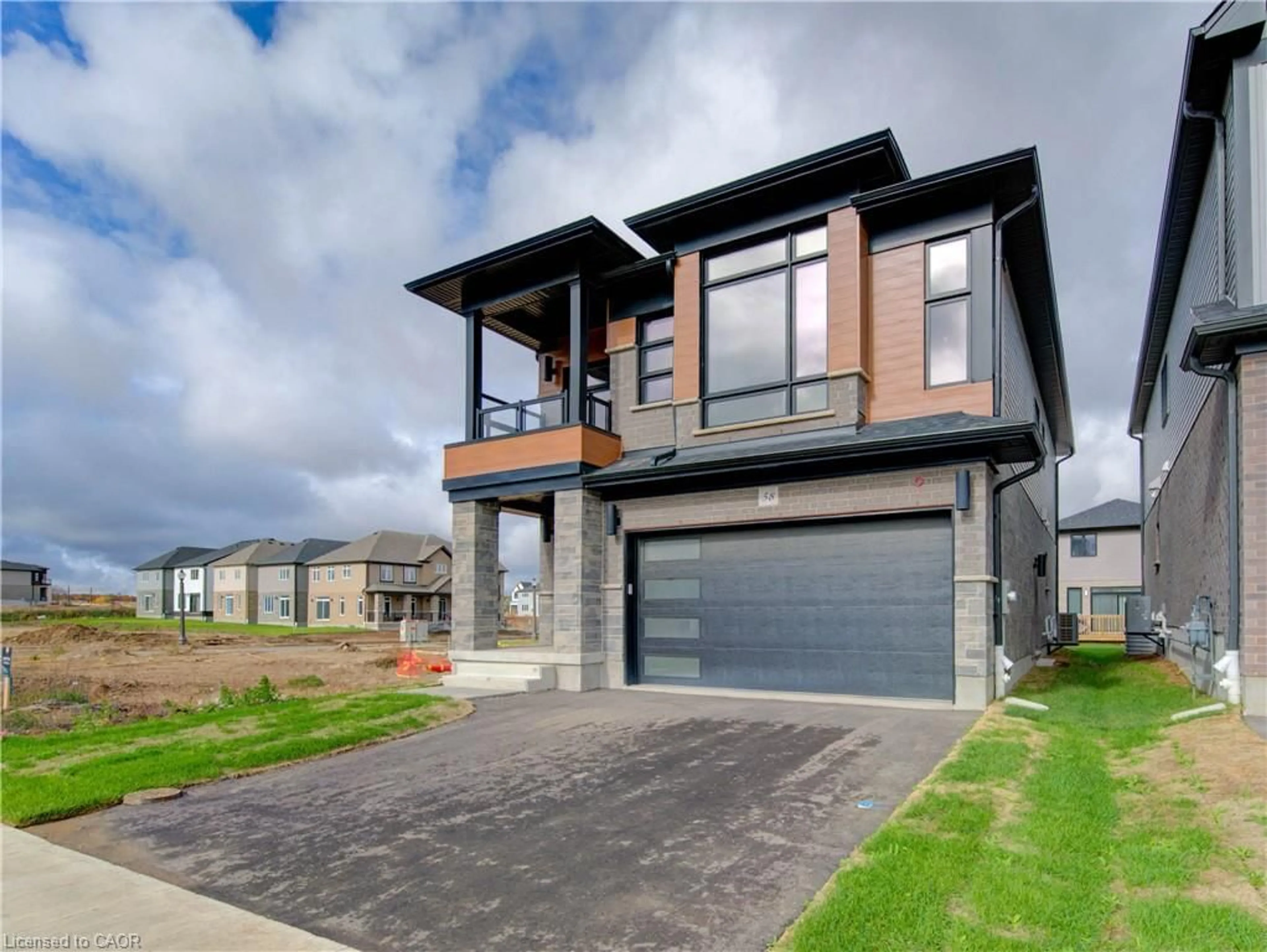 Home with brick exterior material, street for 58 Jacob Detweiller Dr, Kitchener Ontario N2P 0K7
