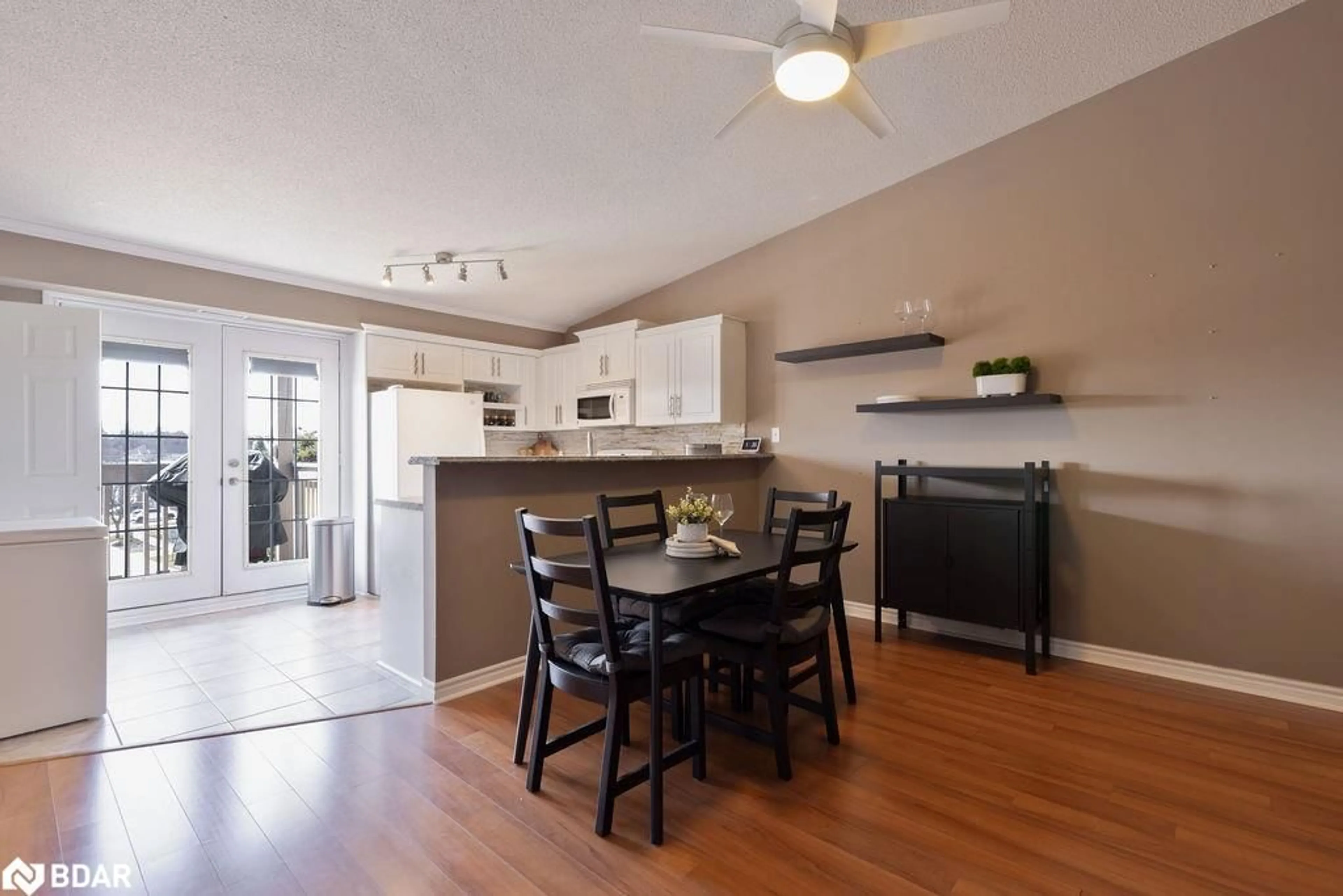 Open concept kitchen, wood/laminate floor for 4003 Kilmer Dr #411, Burlington Ontario L7M 4M1