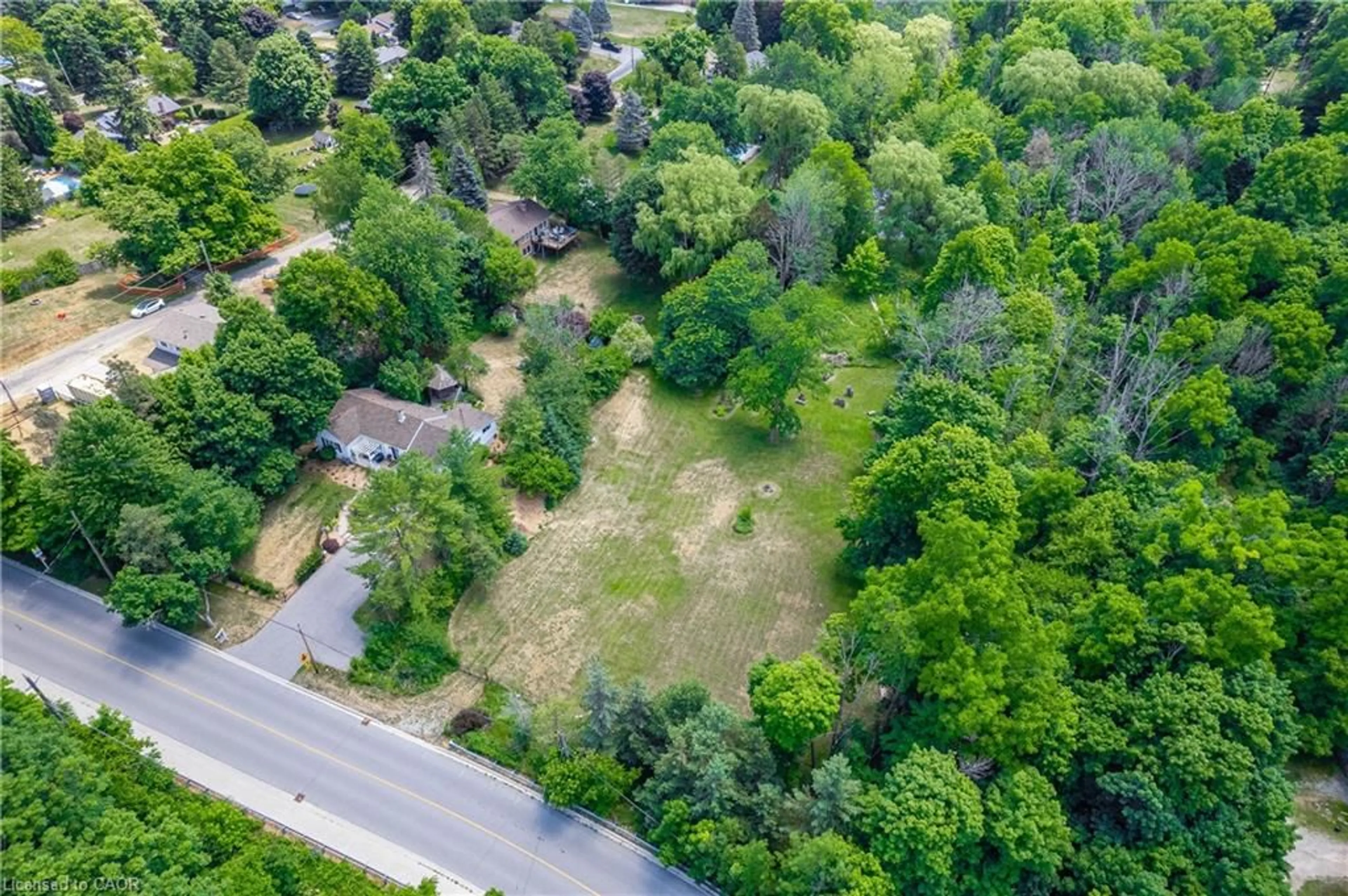 A pic from outside/outdoor area/front of a property/back of a property/a pic from drone, forest/trees view for 2150 Kilbride St, Burlington Ontario L7P 0J3