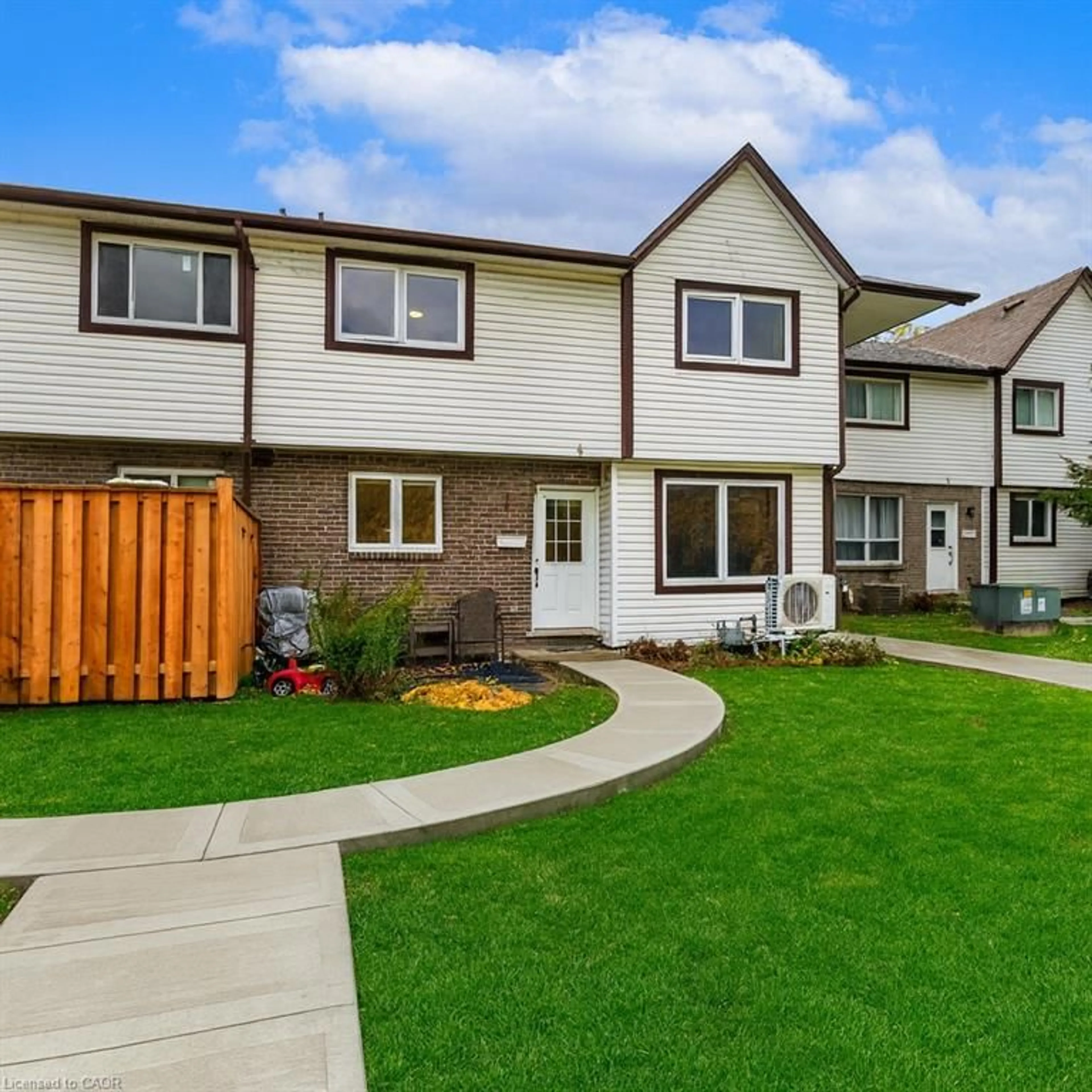Home with vinyl exterior material, street for 445 Pioneer Dr #4, Kitchener Ontario N2P 1L8