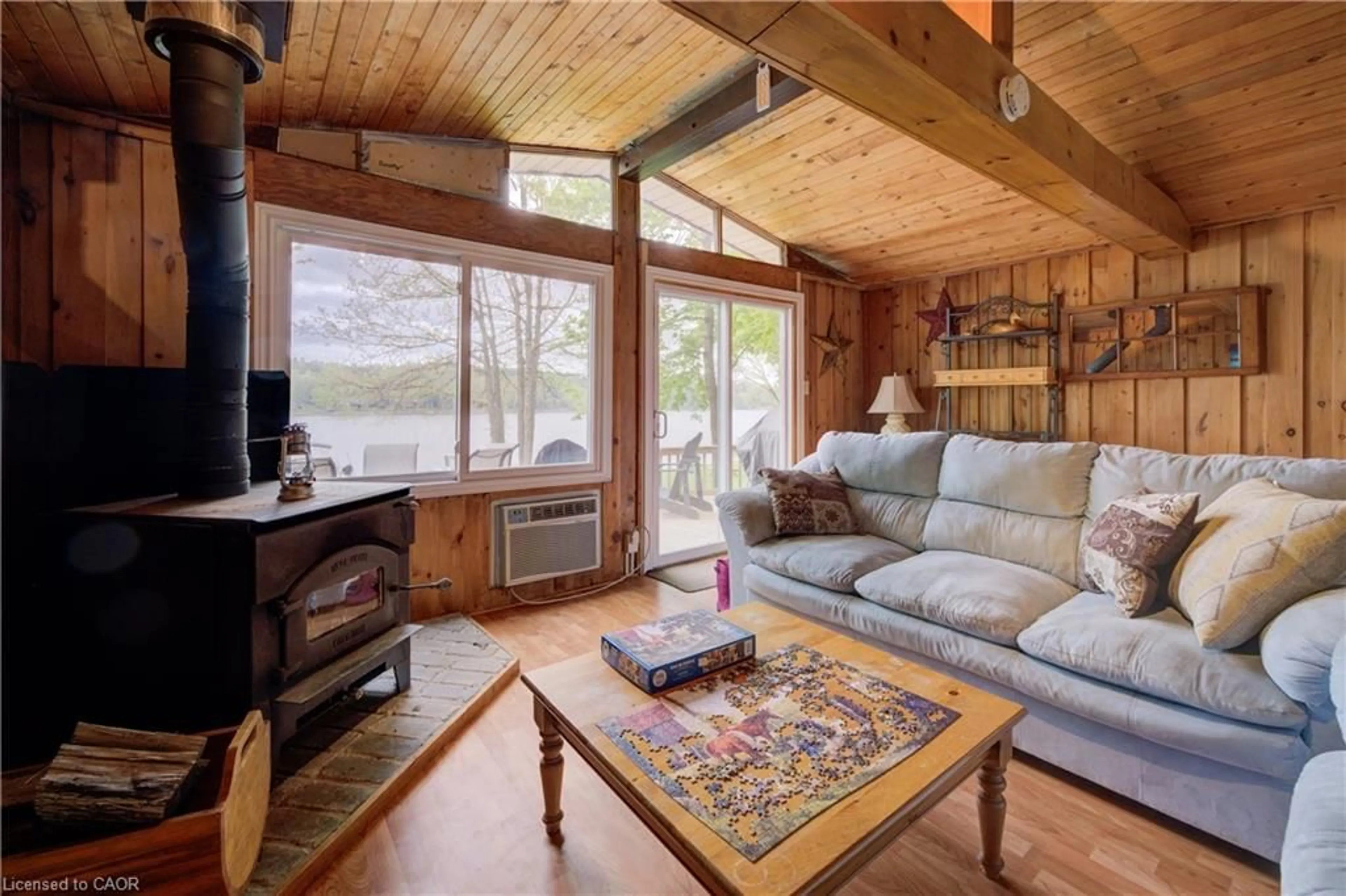 Living room with furniture, wood/laminate floor for 457 Road 4, Conestogo Lake Ontario N0G 1P0
