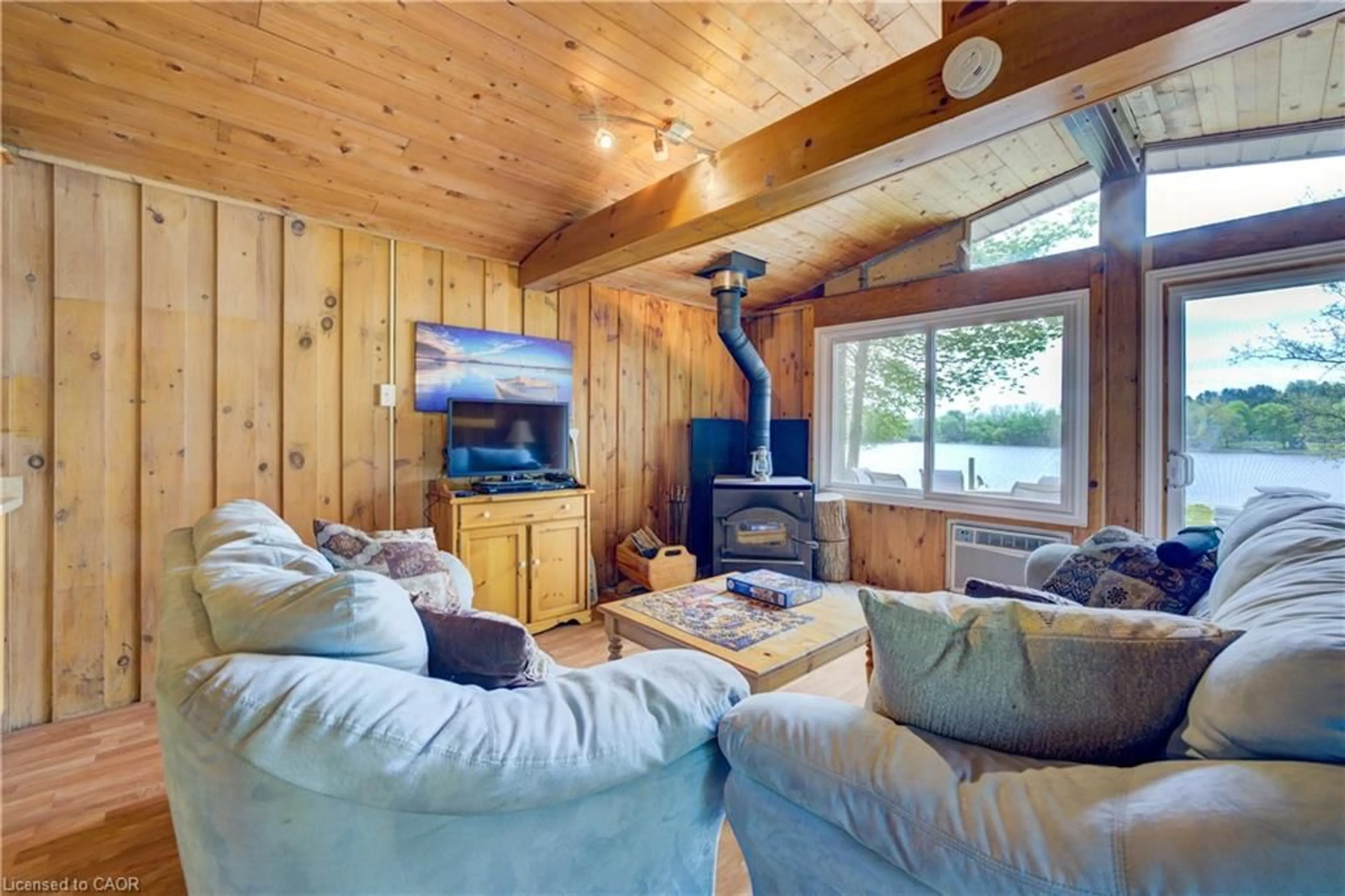 Living room with furniture, wood/laminate floor for 457 Road 4, Conestogo Lake Ontario N0G 1P0