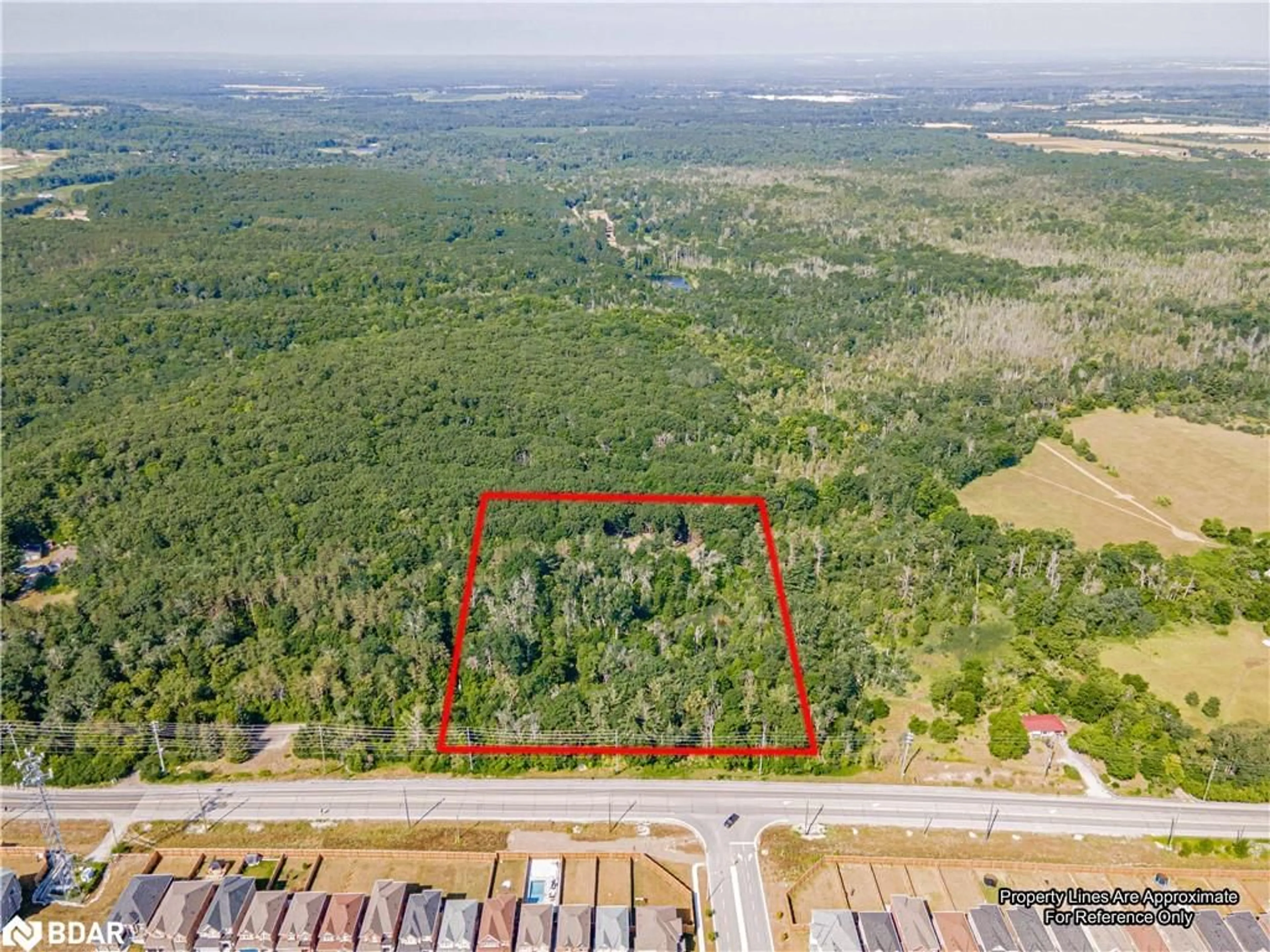 A pic from outside/outdoor area/front of a property/back of a property/a pic from drone, forest/trees view for 8294 County Rd 27, Barrie Ontario L4N 9C4