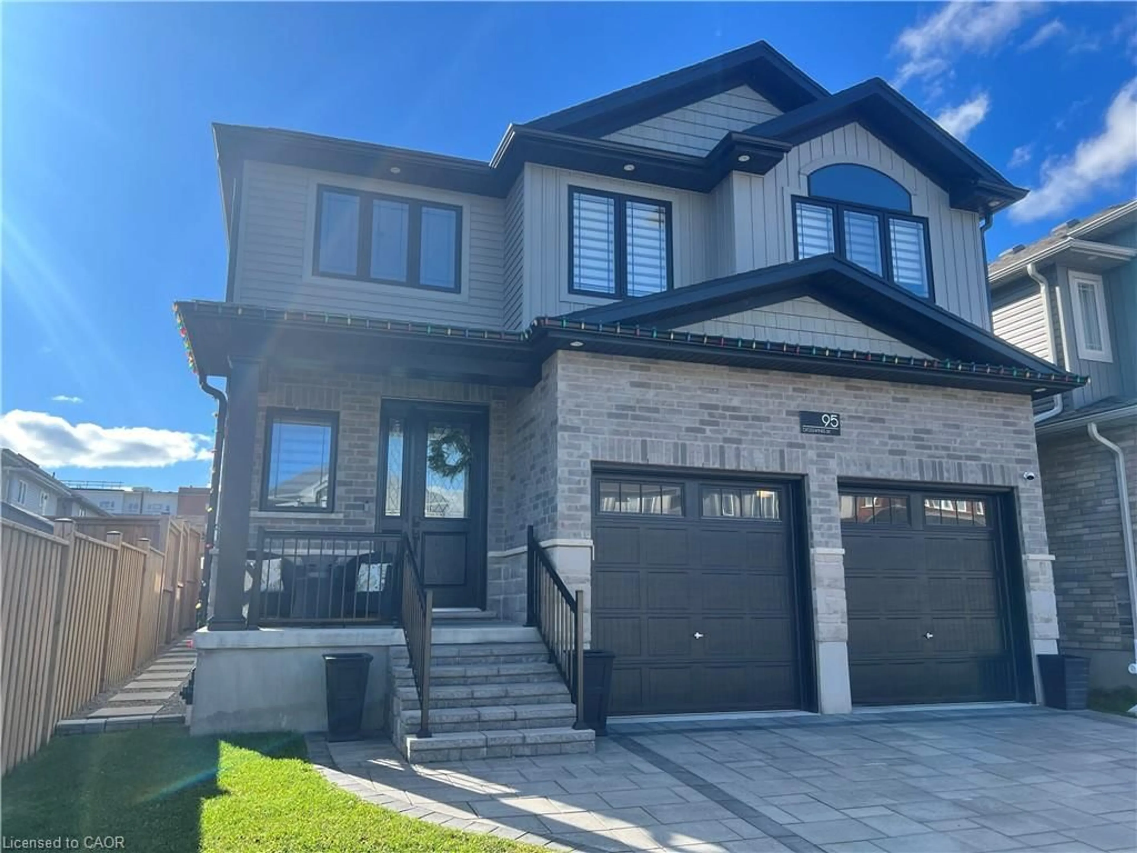 Home with brick exterior material, street for 95 Crosswinds Dr, Kitchener Ontario N2A 0J9