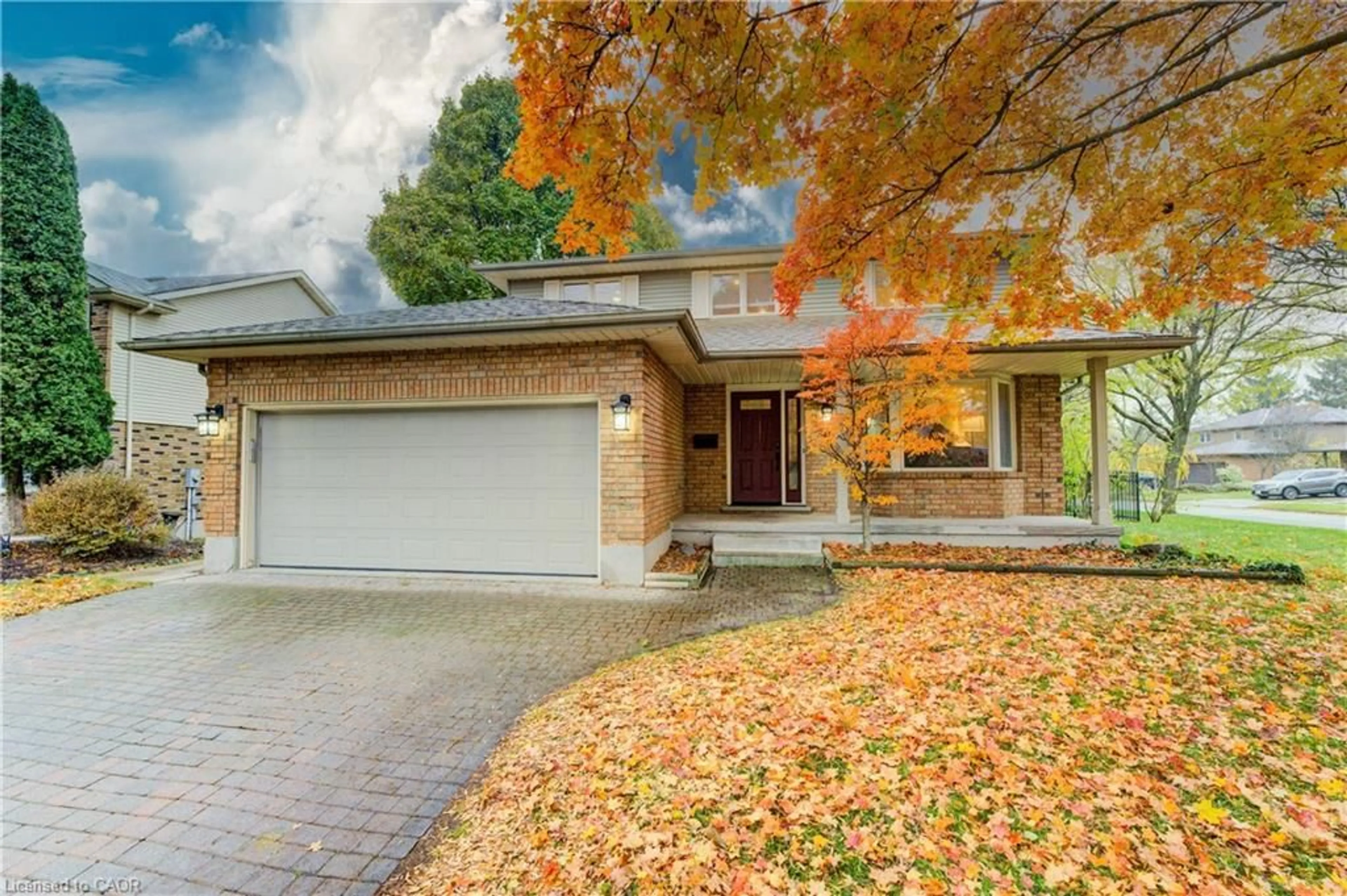 Home with brick exterior material, street for 2 Dunnington Crt, Kitchener Ontario N2A 3M5