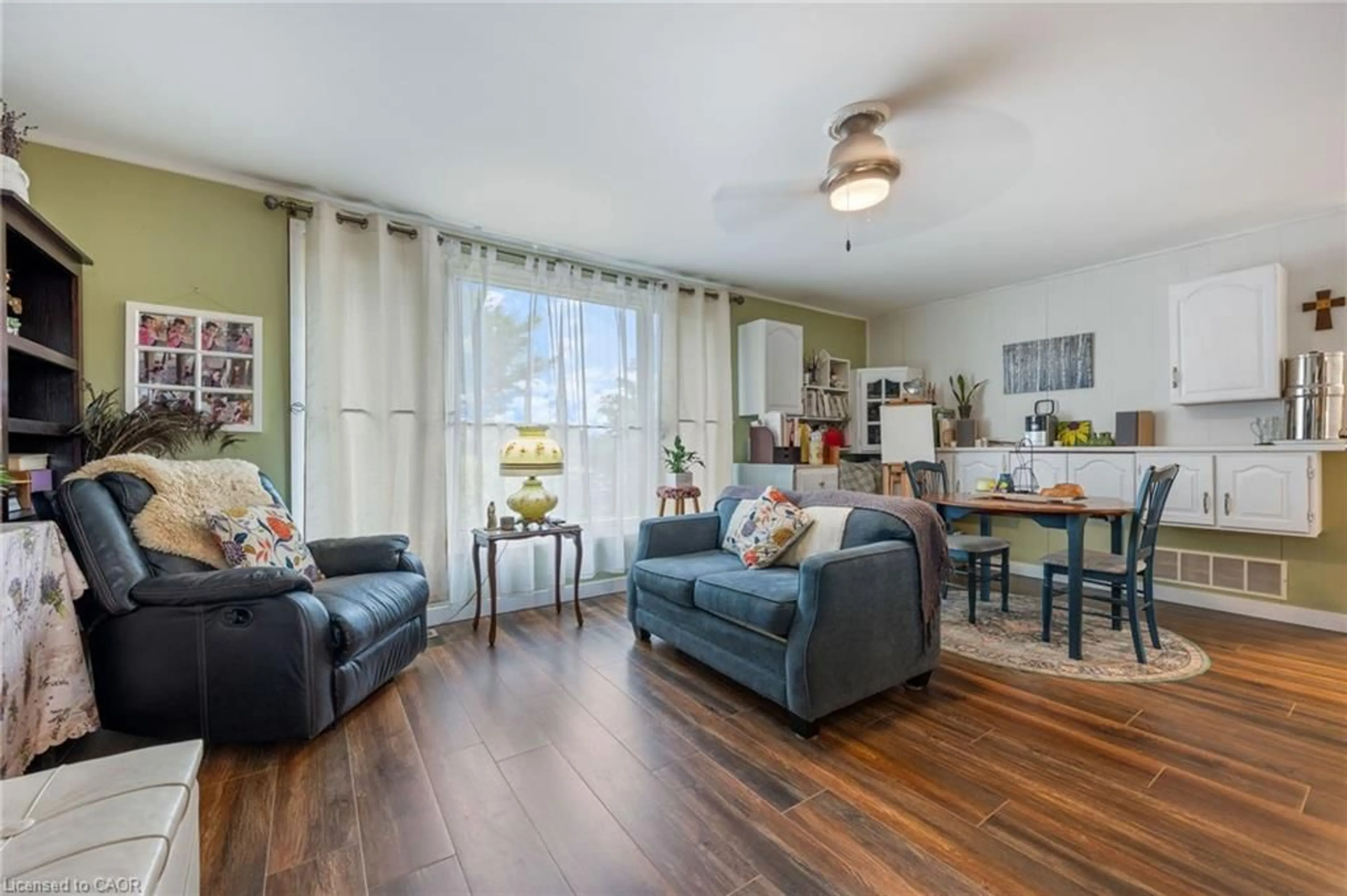 Living room with furniture, wood/laminate floor for 30 Bee St, Booth's Harbour Ontario N0E 1P0