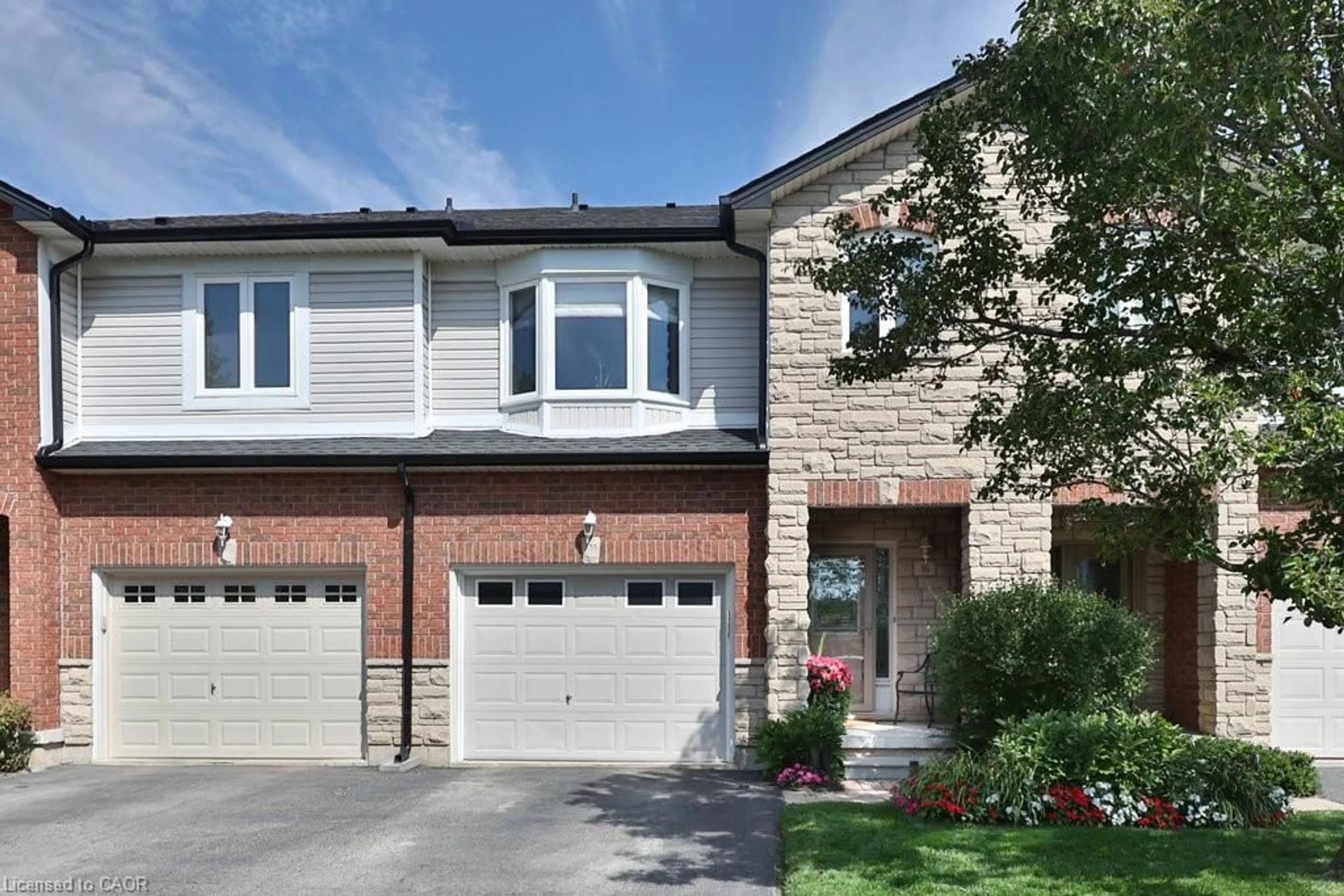 Home with brick exterior material, street for 2229 Walkers Line #16, Burlington Ontario L7M 4X4