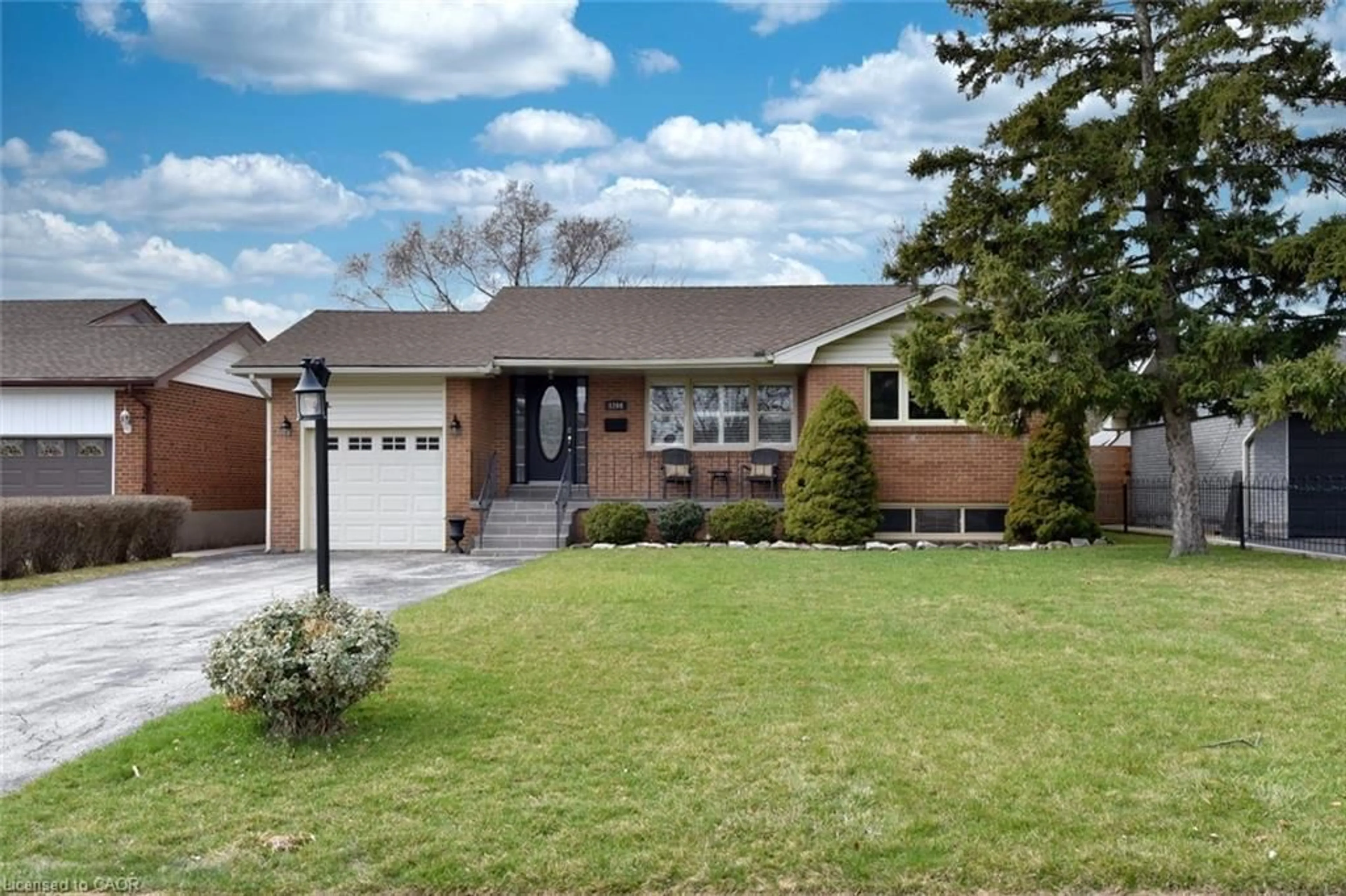 Home with brick exterior material, street for 1204 Tavistock Dr, Burlington Ontario L7P 2N5