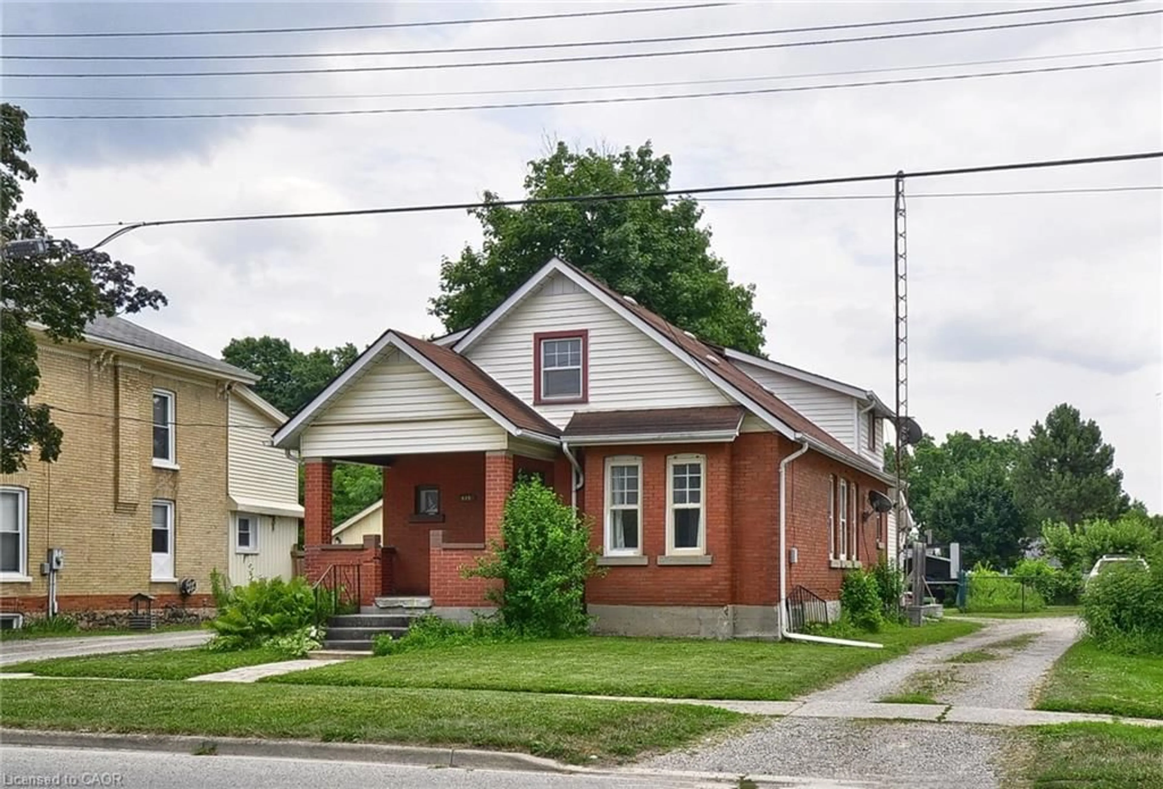 Home with brick exterior material, street for 141 King St, Burford Ontario N0E 1A0