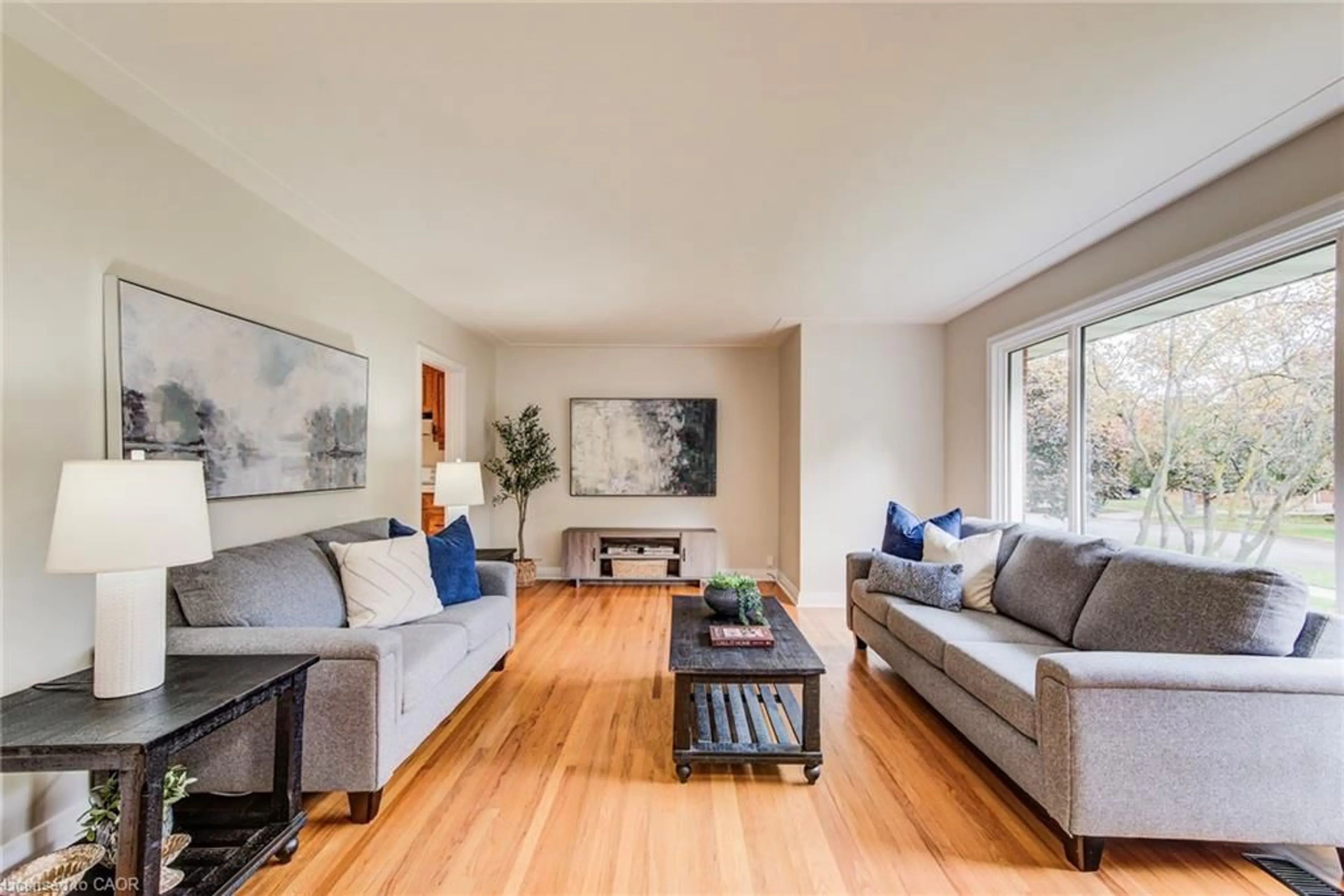 Living room with furniture, wood/laminate floor for 54 Glendale Rd, Kitchener Ontario N2H 2Z8
