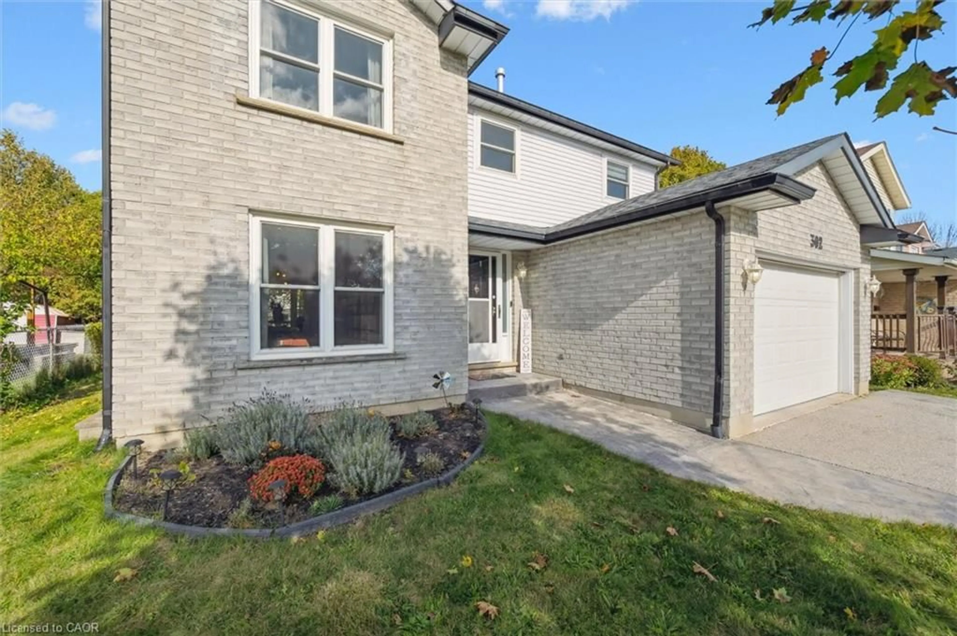 Home with brick exterior material, street for 302 Conservation Dr, Waterloo Ontario N2V 1V5