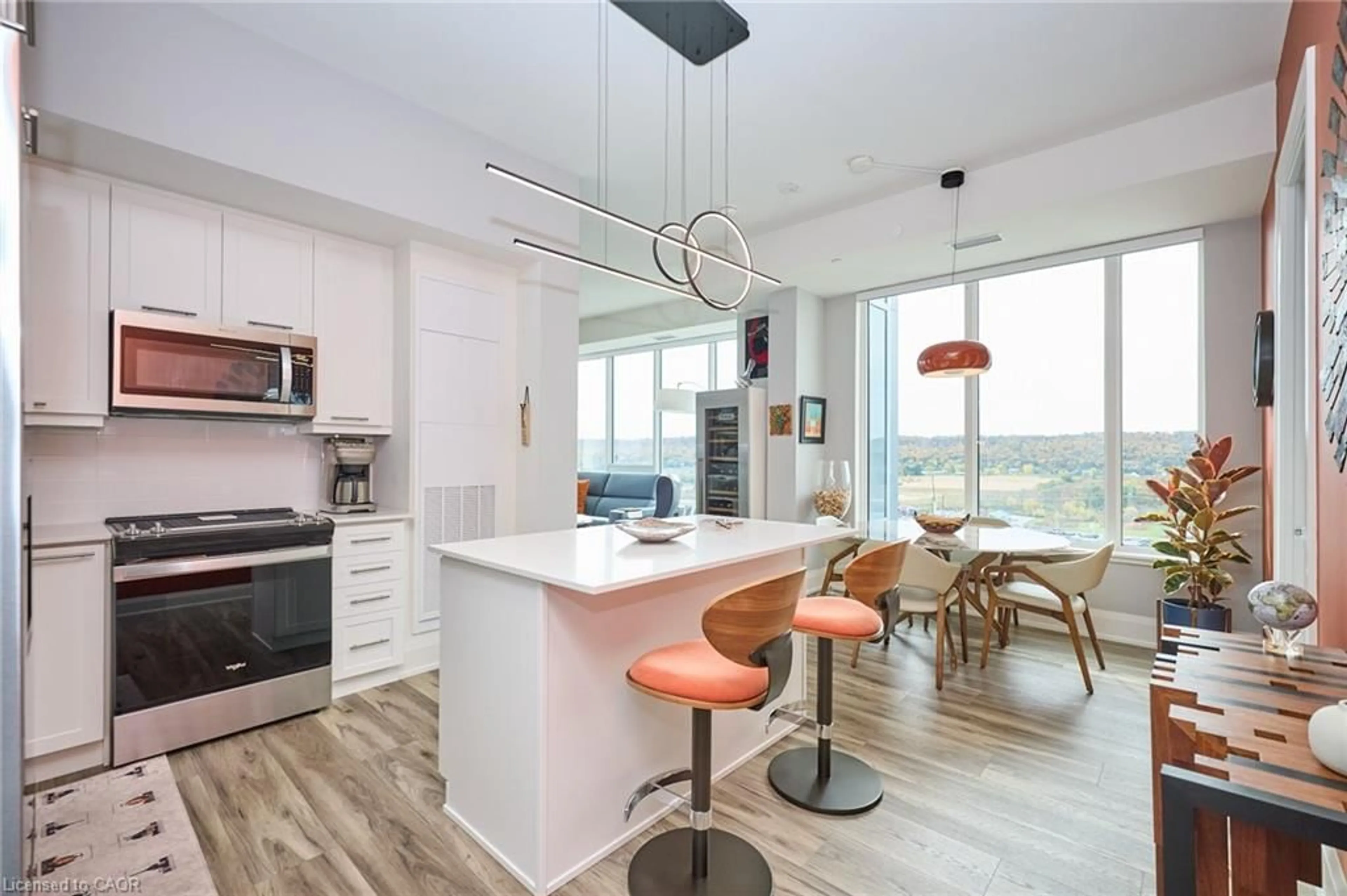 Open concept kitchen, wood/laminate floor for 385 Winston Rd #1807, Grimsby Ontario L3M 4E8