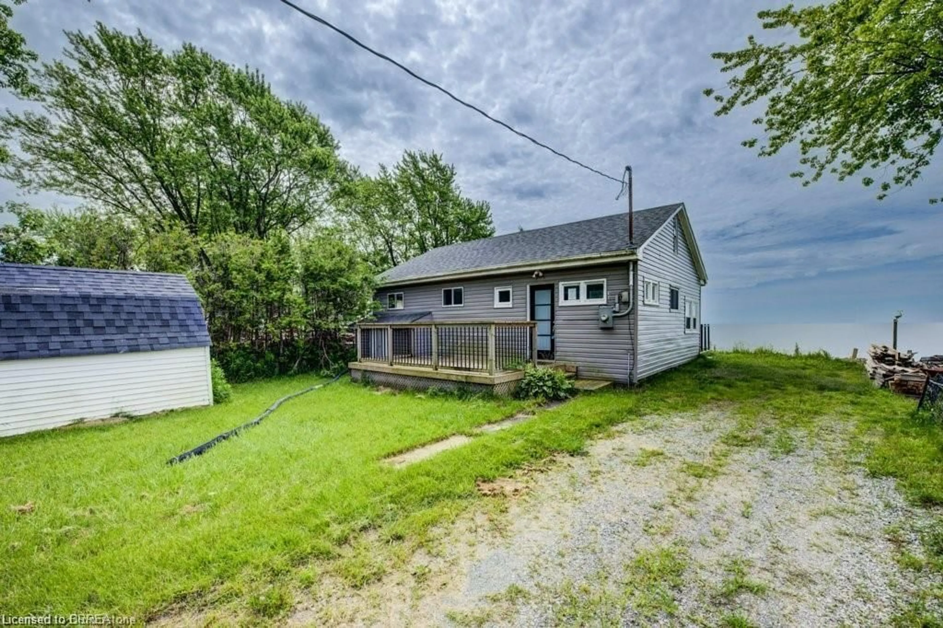 A pic from outside/outdoor area/front of a property/back of a property/a pic from drone, water/lake/river/ocean view for 41 Derner Line, Dunnville Ontario N0A 1K0