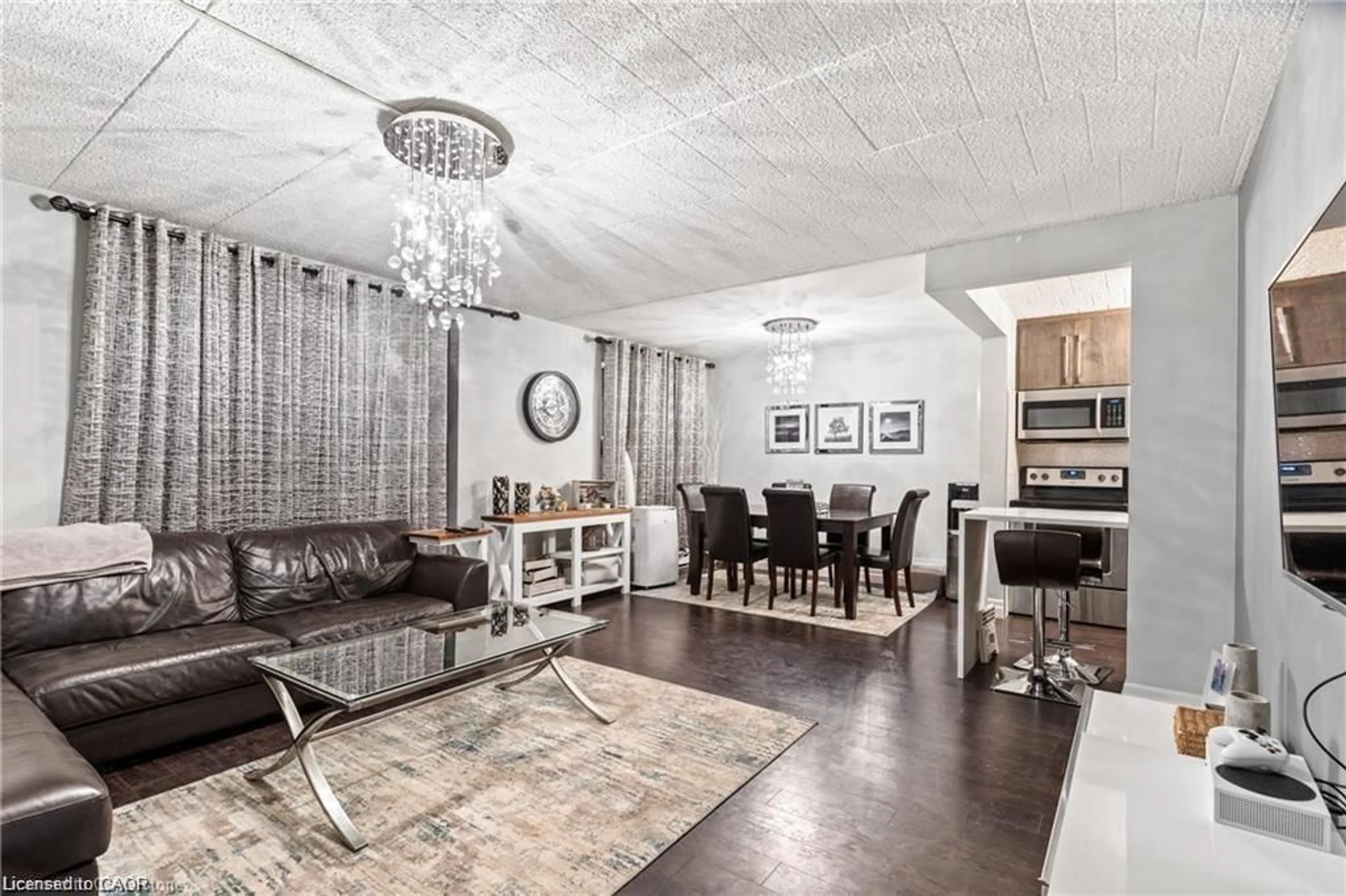 Living room with furniture, wood/laminate floor for 6 Walton Ave #310, Kitchener Ontario N2C 2B5