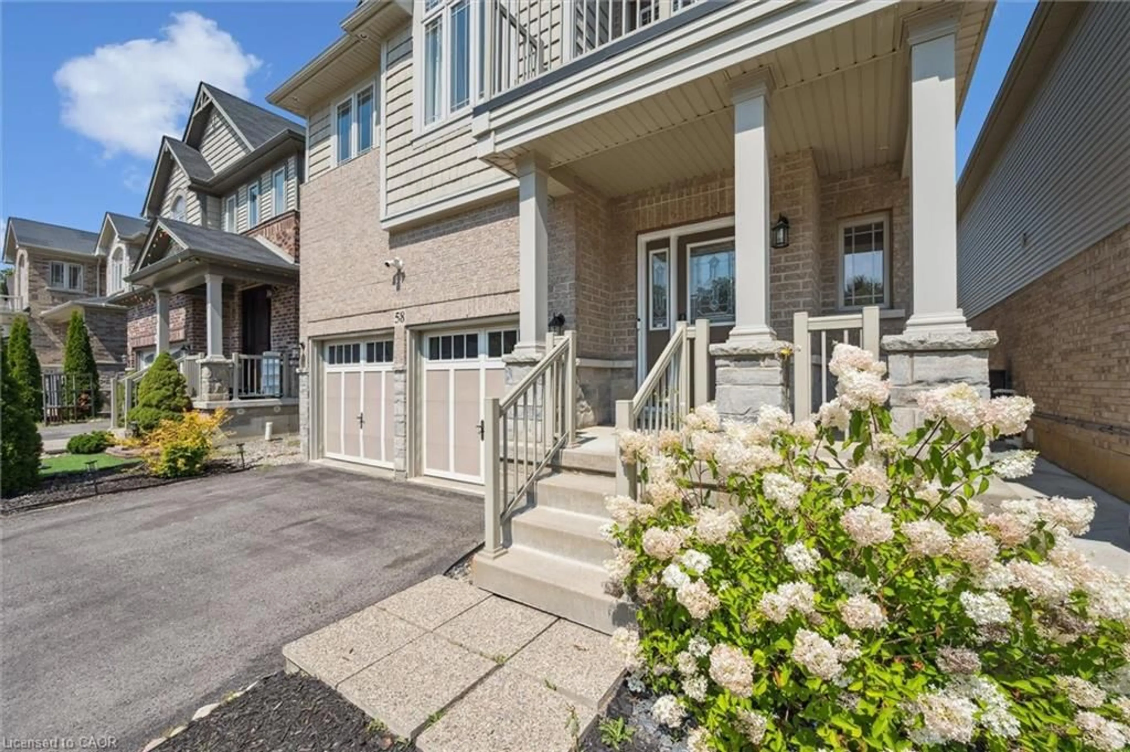 Home with vinyl exterior material, street for 58 Elmbank Trail, Kitchener Ontario N2R 0H1