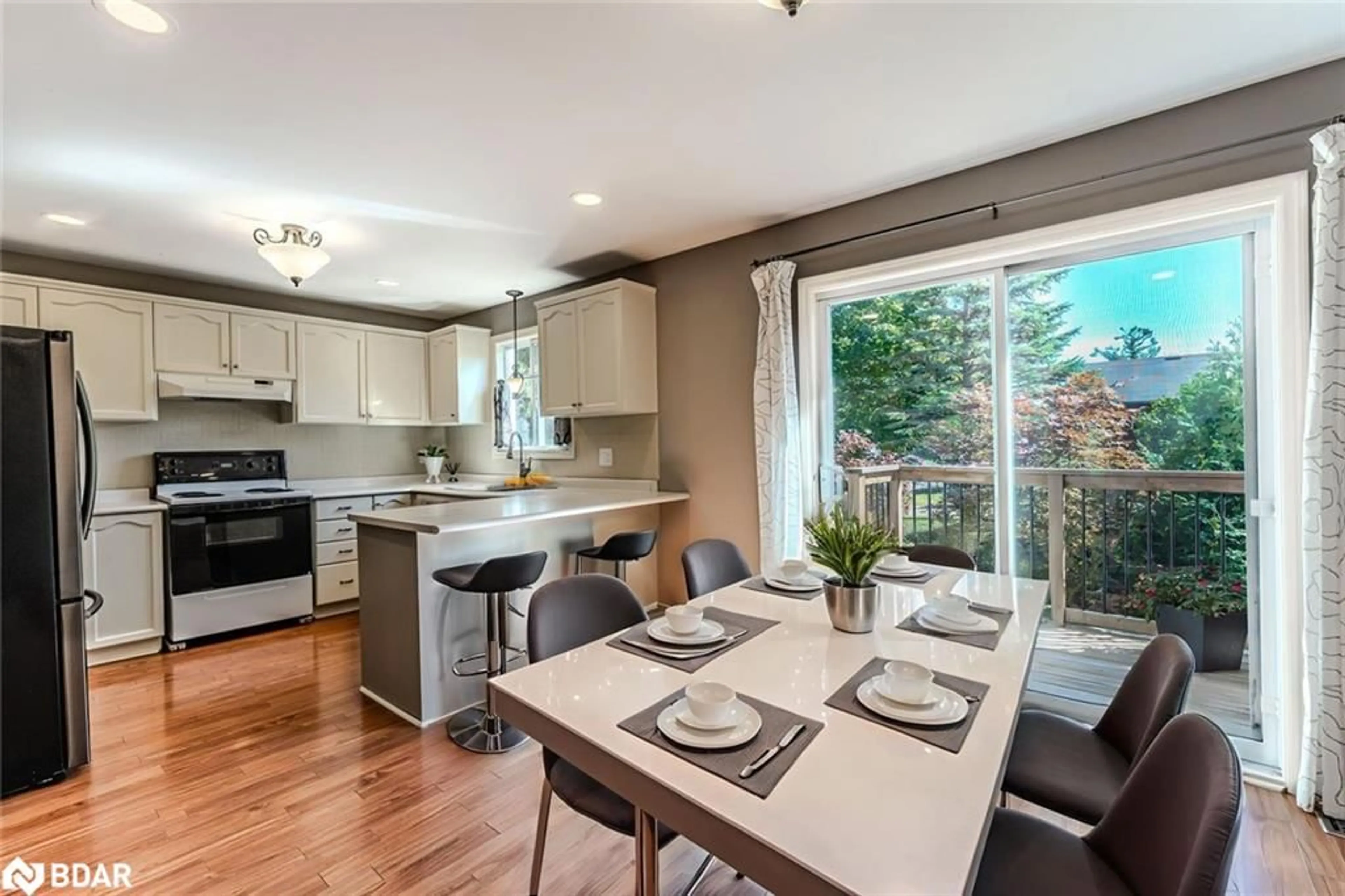 Open concept kitchen, wood/laminate floor for 239 Simcoe St, Stayner Ontario L0M 1S0