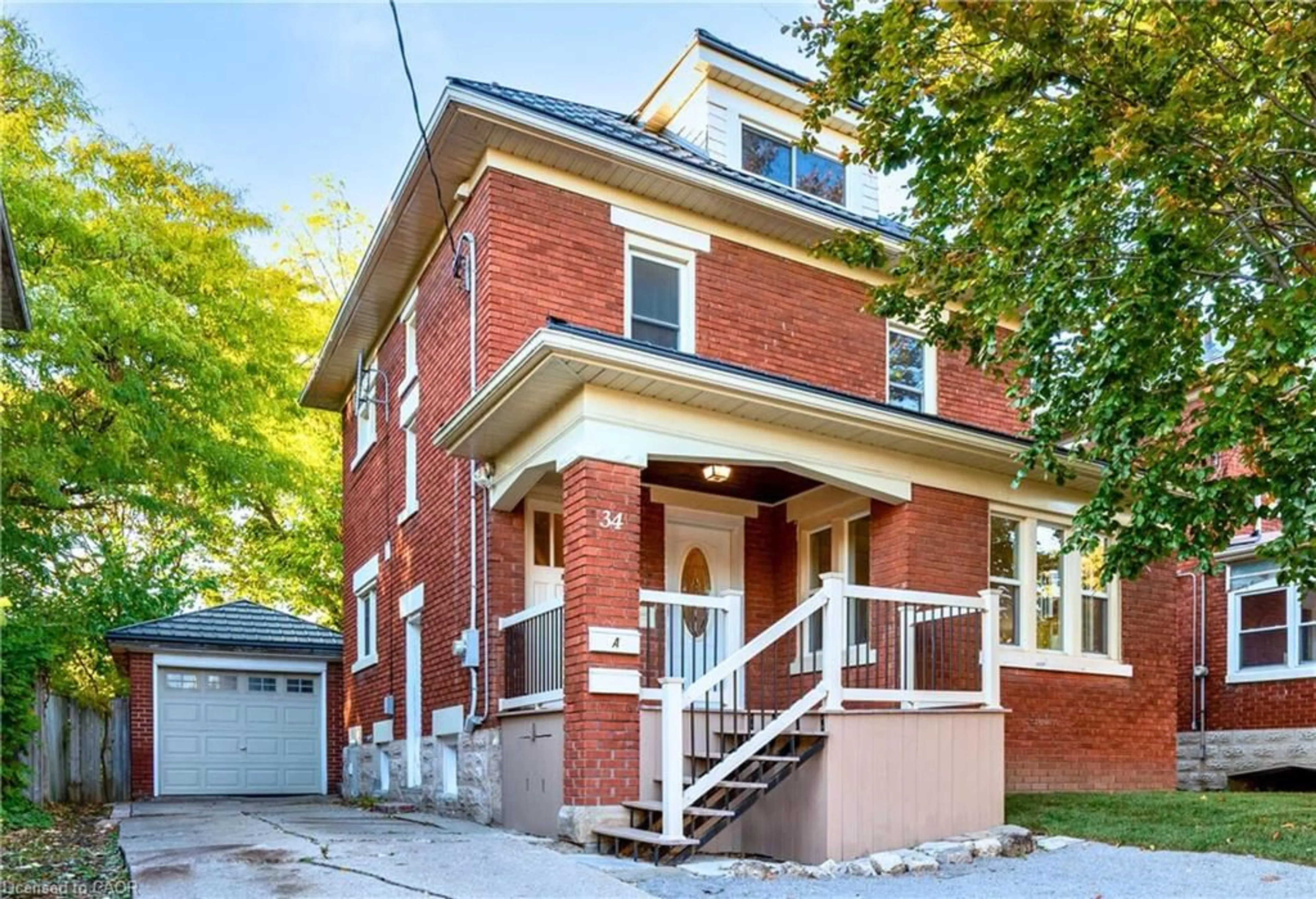 Home with brick exterior material, street for 34 Stirling Ave, Kitchener Ontario N2H 3G5