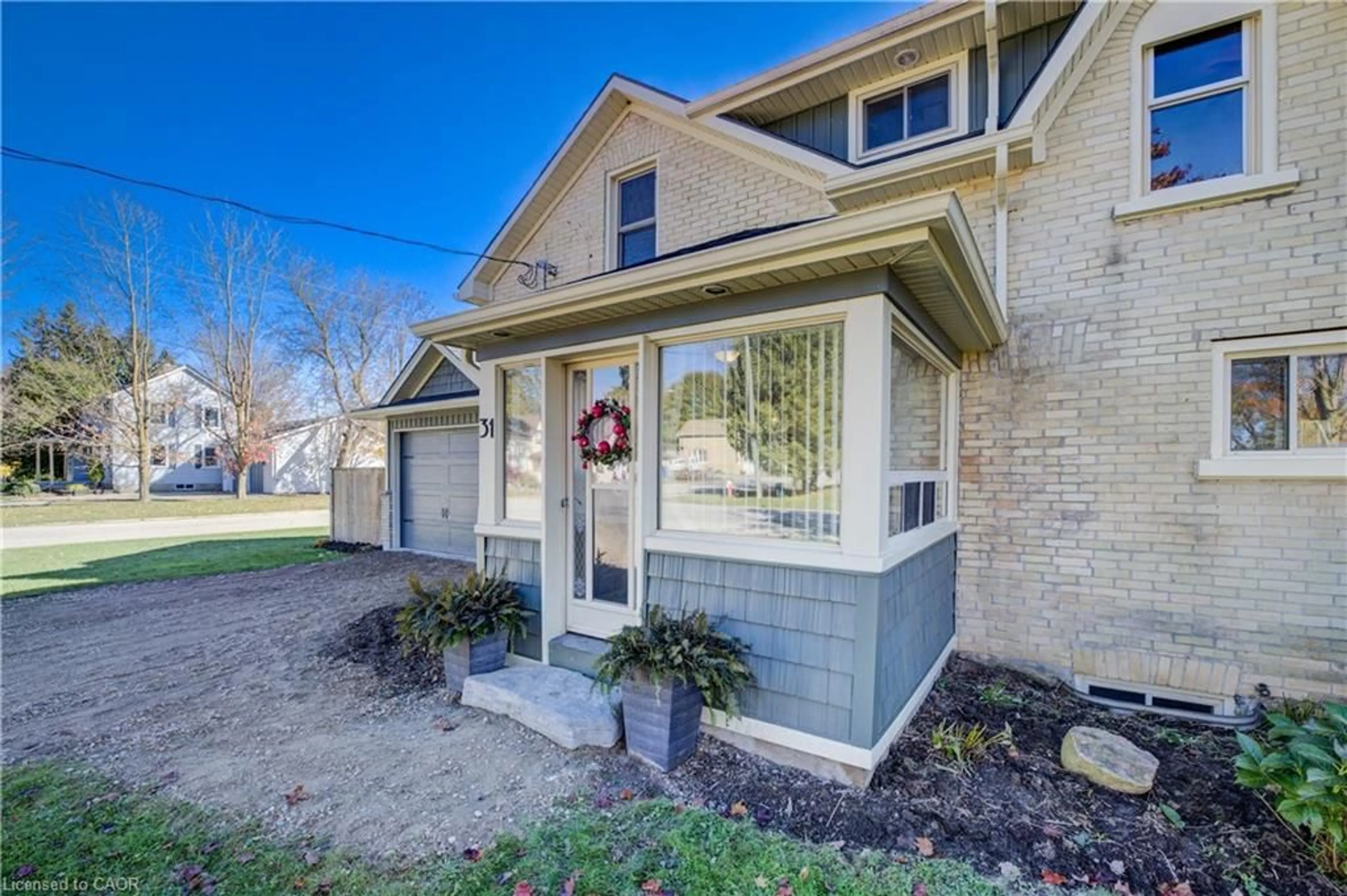 Home with brick exterior material, street for 31 Pellister St, Harriston Ontario N0G 1Z0