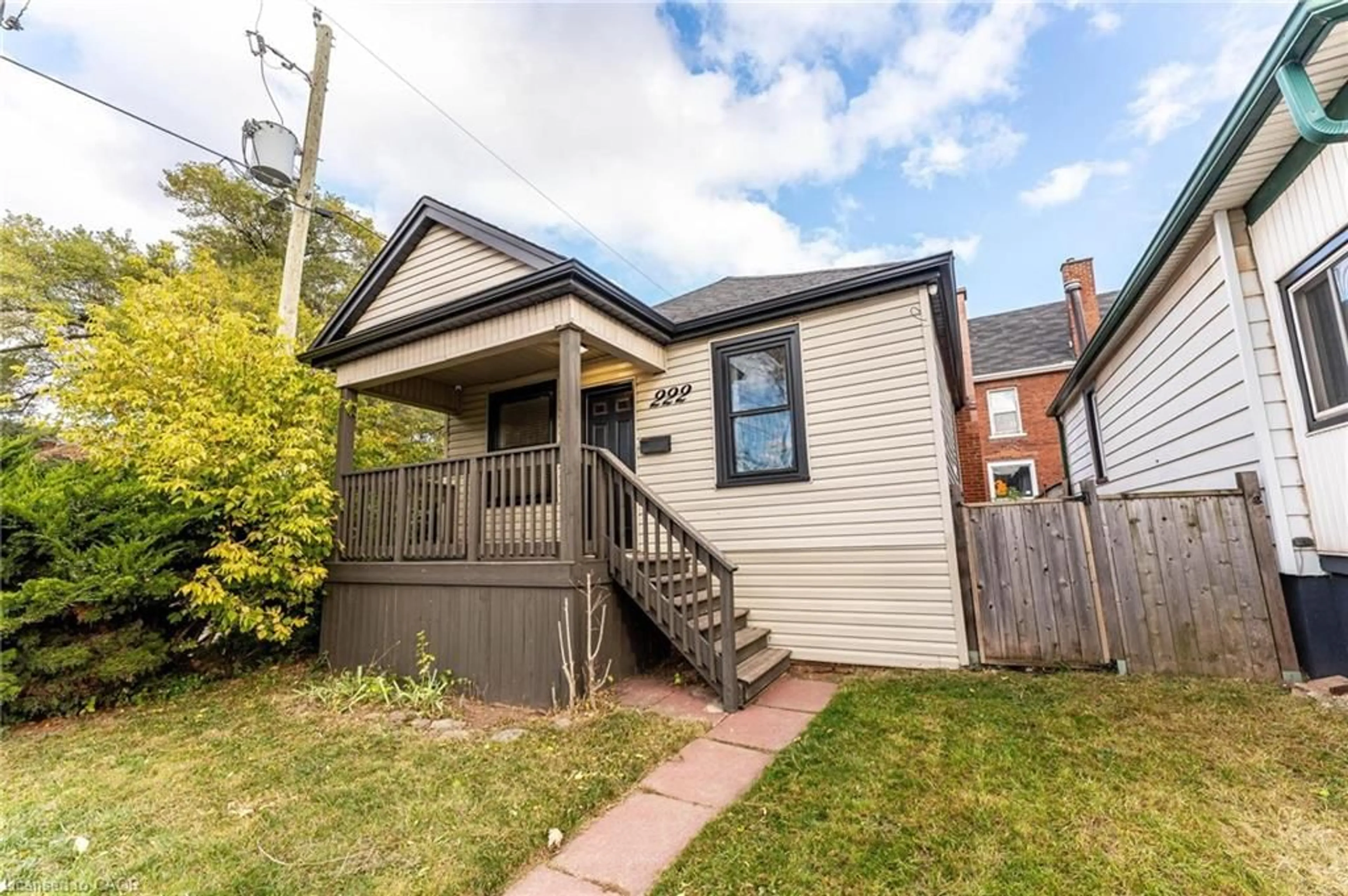 Home with brick exterior material, street for 222 Kensington Ave, Hamilton Ontario L8L 7N7