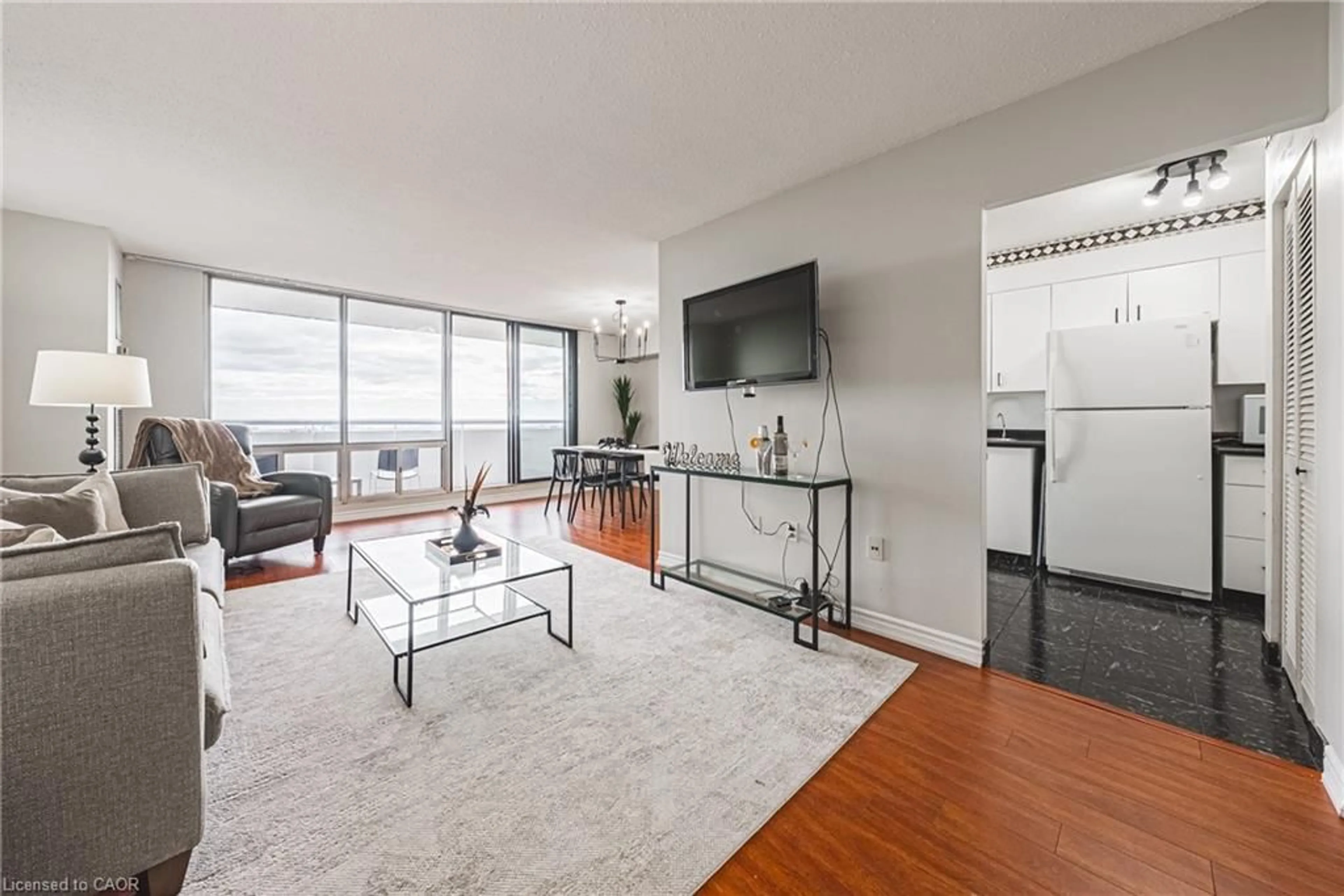 Living room with furniture, unknown for 2055 Upper Middle Rd #1206, Burlington Ontario L7P 3P4