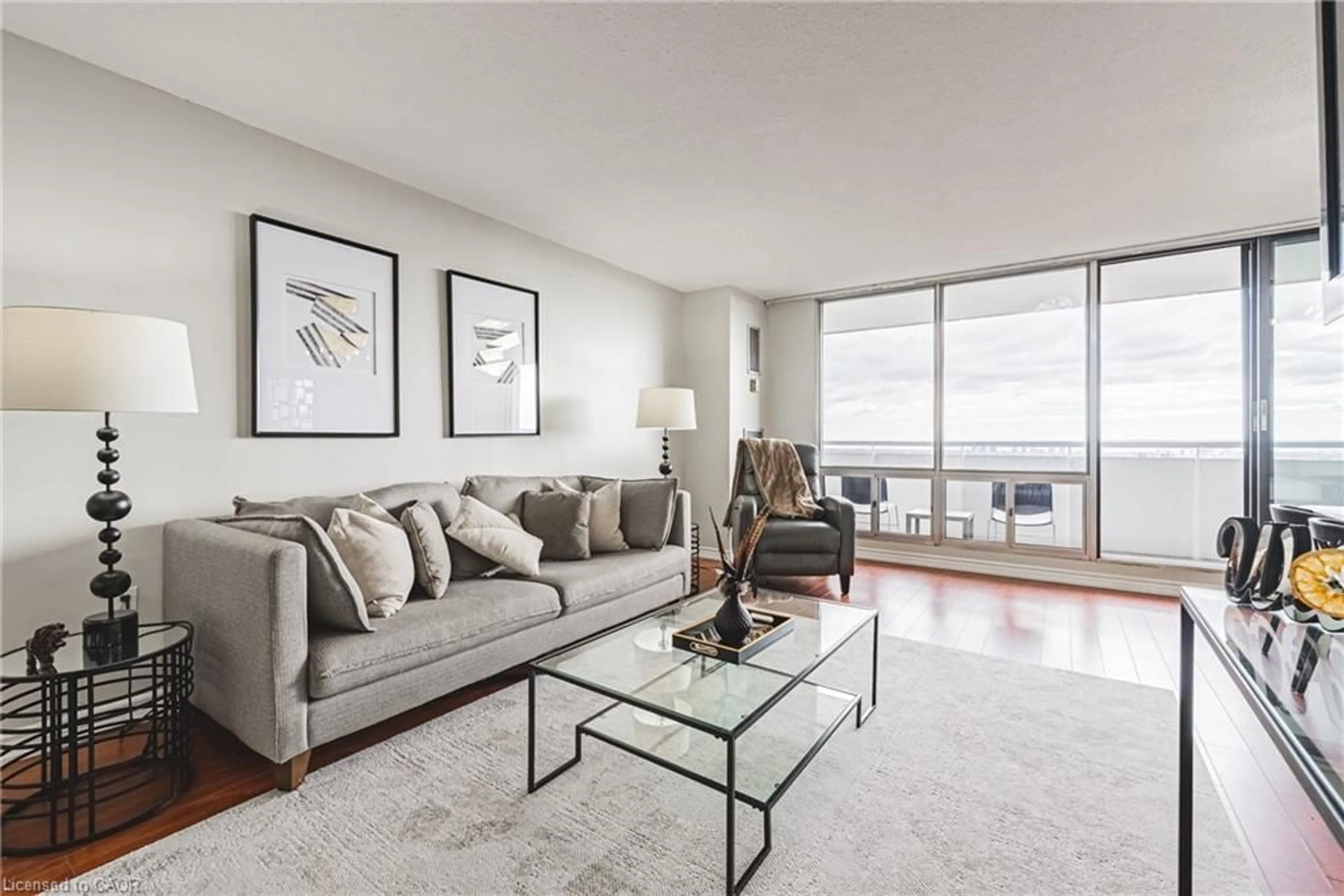 Living room with furniture, unknown for 2055 Upper Middle Rd #1206, Burlington Ontario L7P 3P4