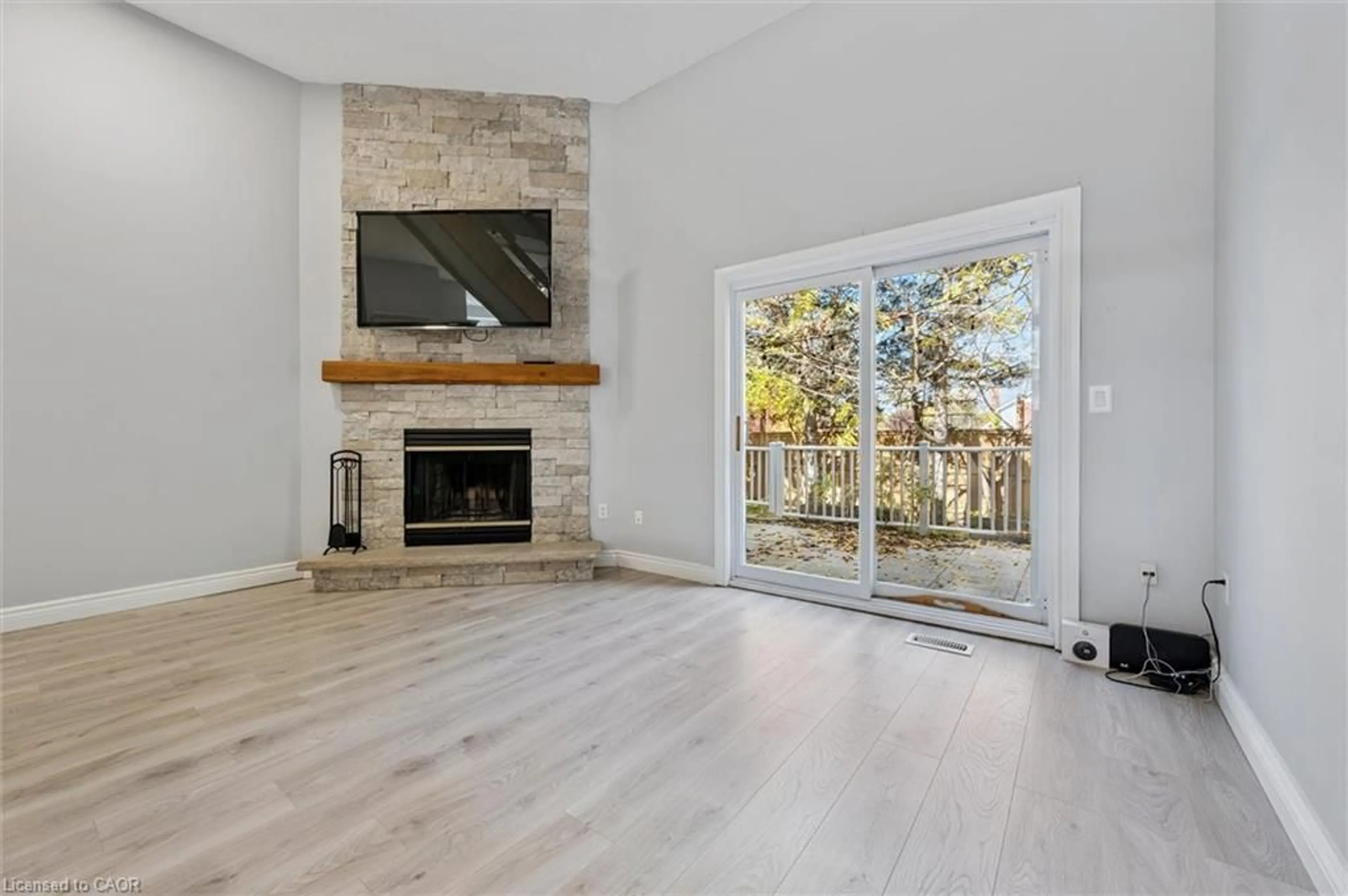 Living room with furniture, wood/laminate floor for 589 Beechwood Dr #5, Waterloo Ontario N2T 2K9