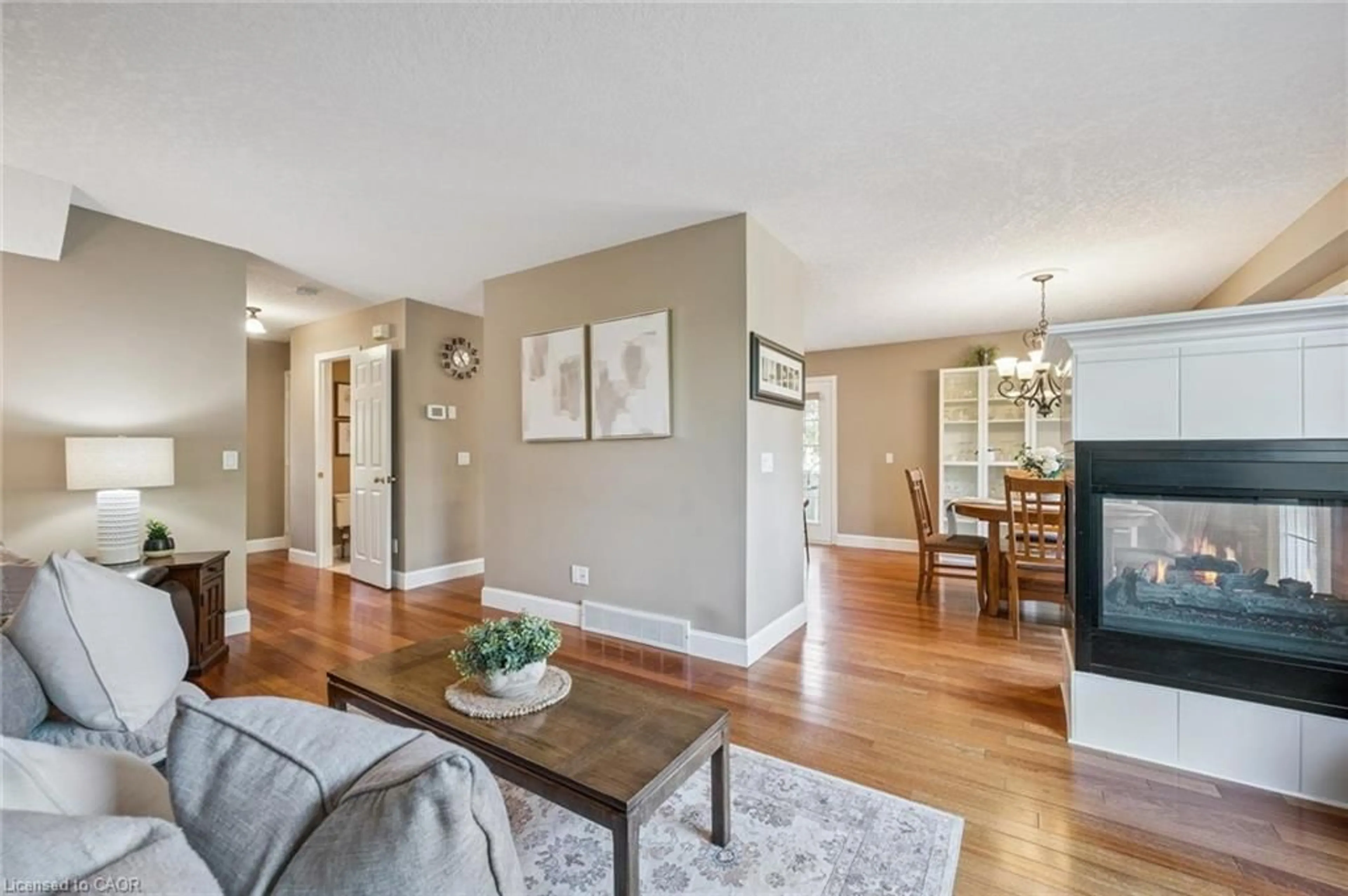 Living room with furniture, wood/laminate floor for 690 Coldstream Dr, Waterloo Ontario N2V 2J1