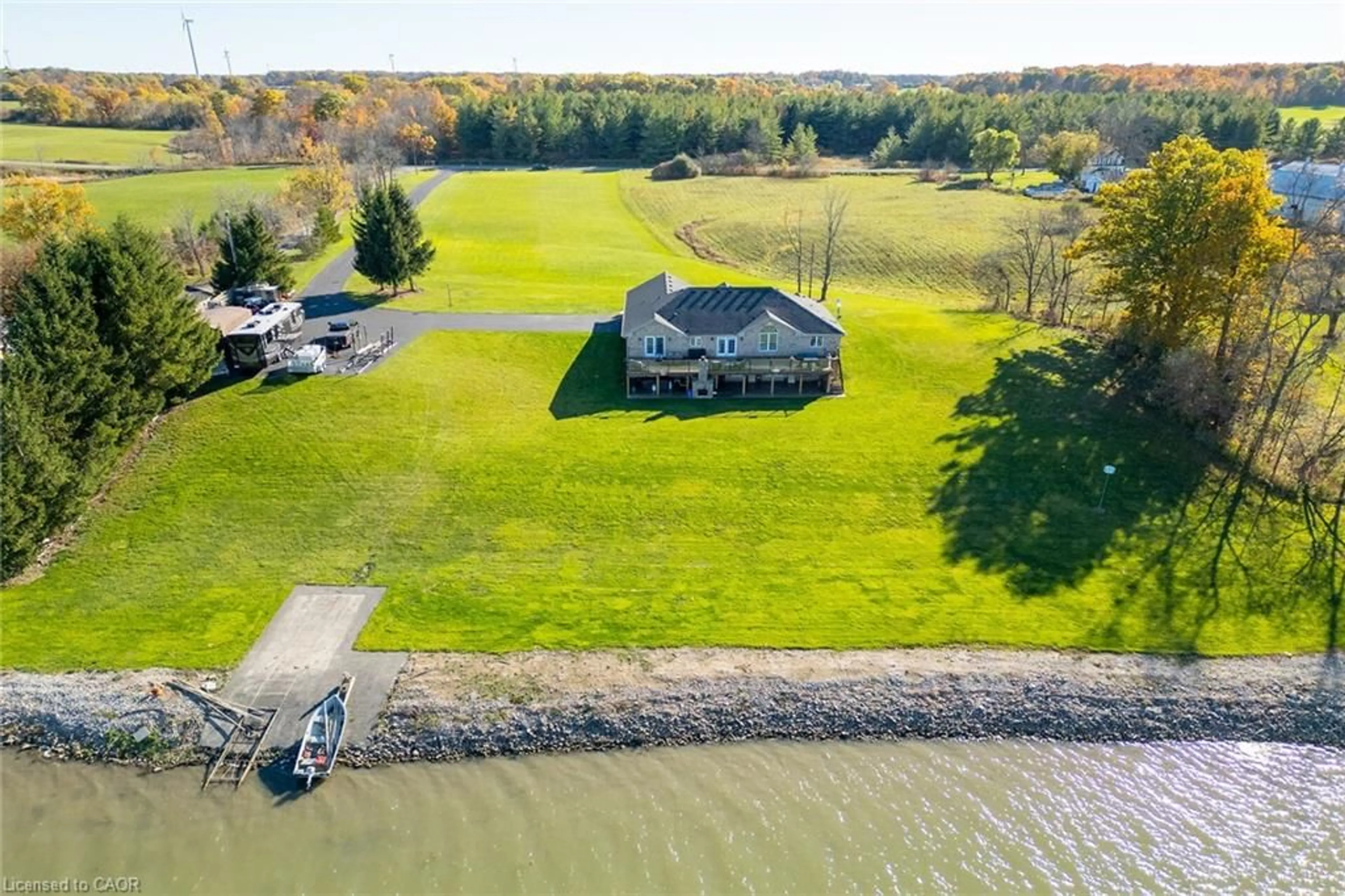 A pic from outside/outdoor area/front of a property/back of a property/a pic from drone, water/lake/river/ocean view for 1140 River Rd, Cayuga Ontario N0A 1E0