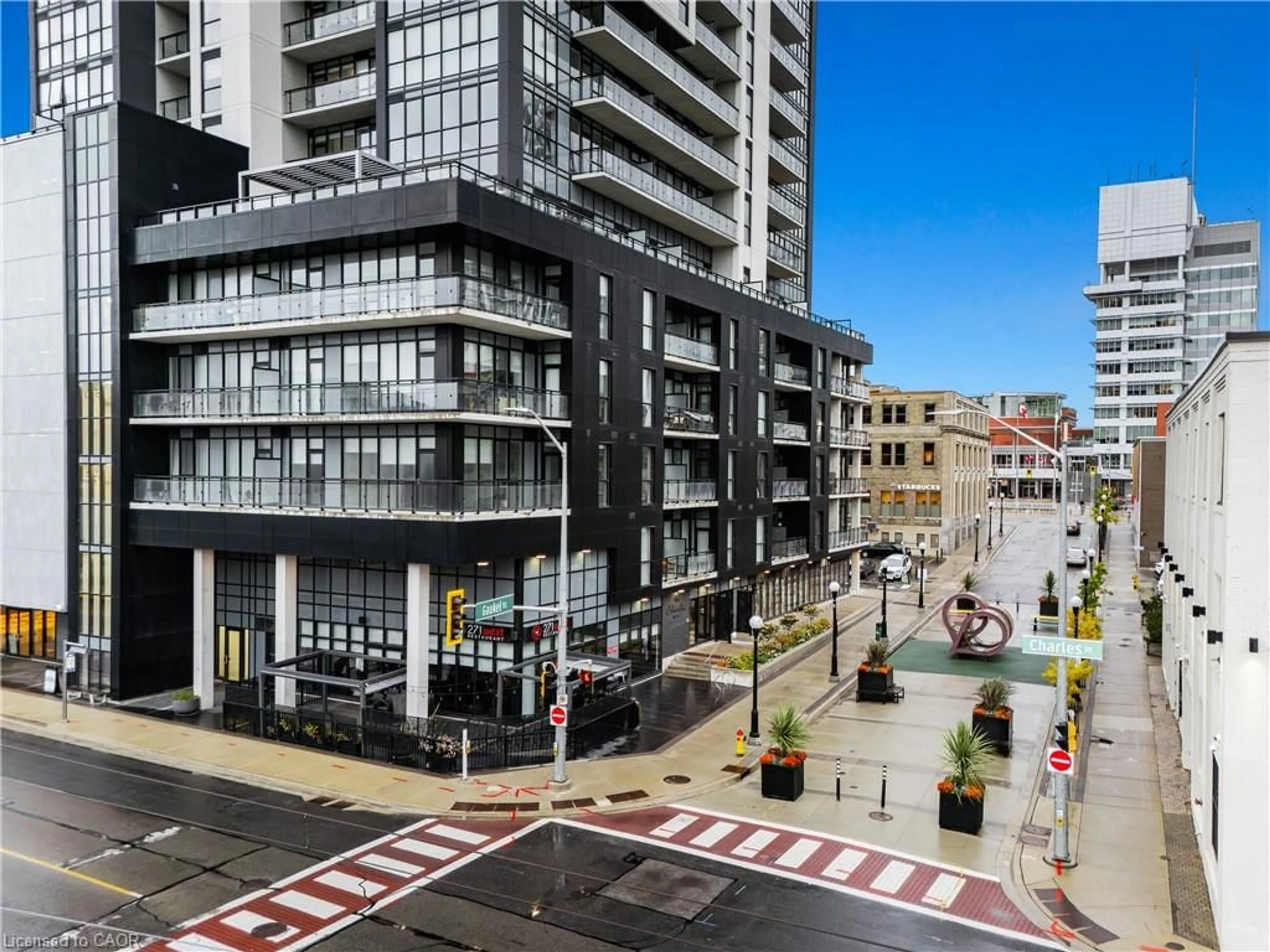 A pic from outside/outdoor area/front of a property/back of a property/a pic from drone, city buildings view from balcony for 60 Charles St #2407, Kitchener Ontario N2G 0C9