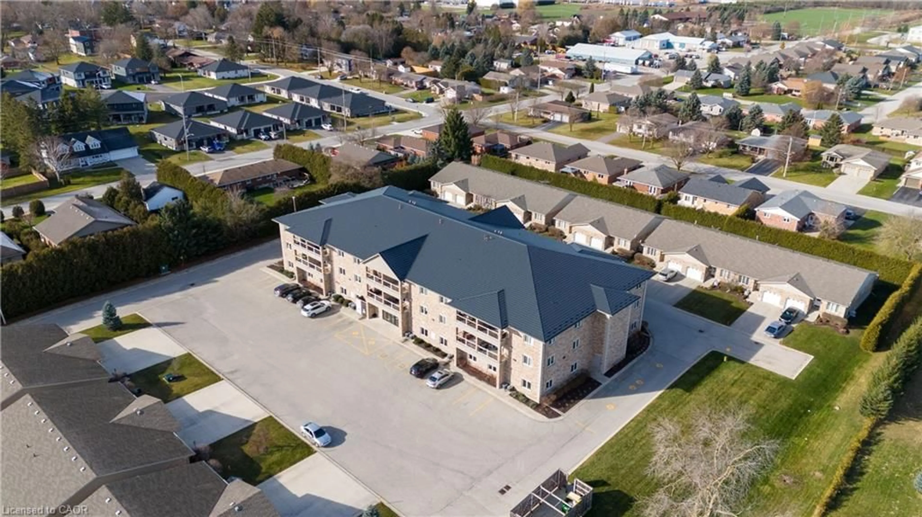 A pic from outside/outdoor area/front of a property/back of a property/a pic from drone, building for 401 Birmingham St #209, Mount Forest Ontario N0G 2L2