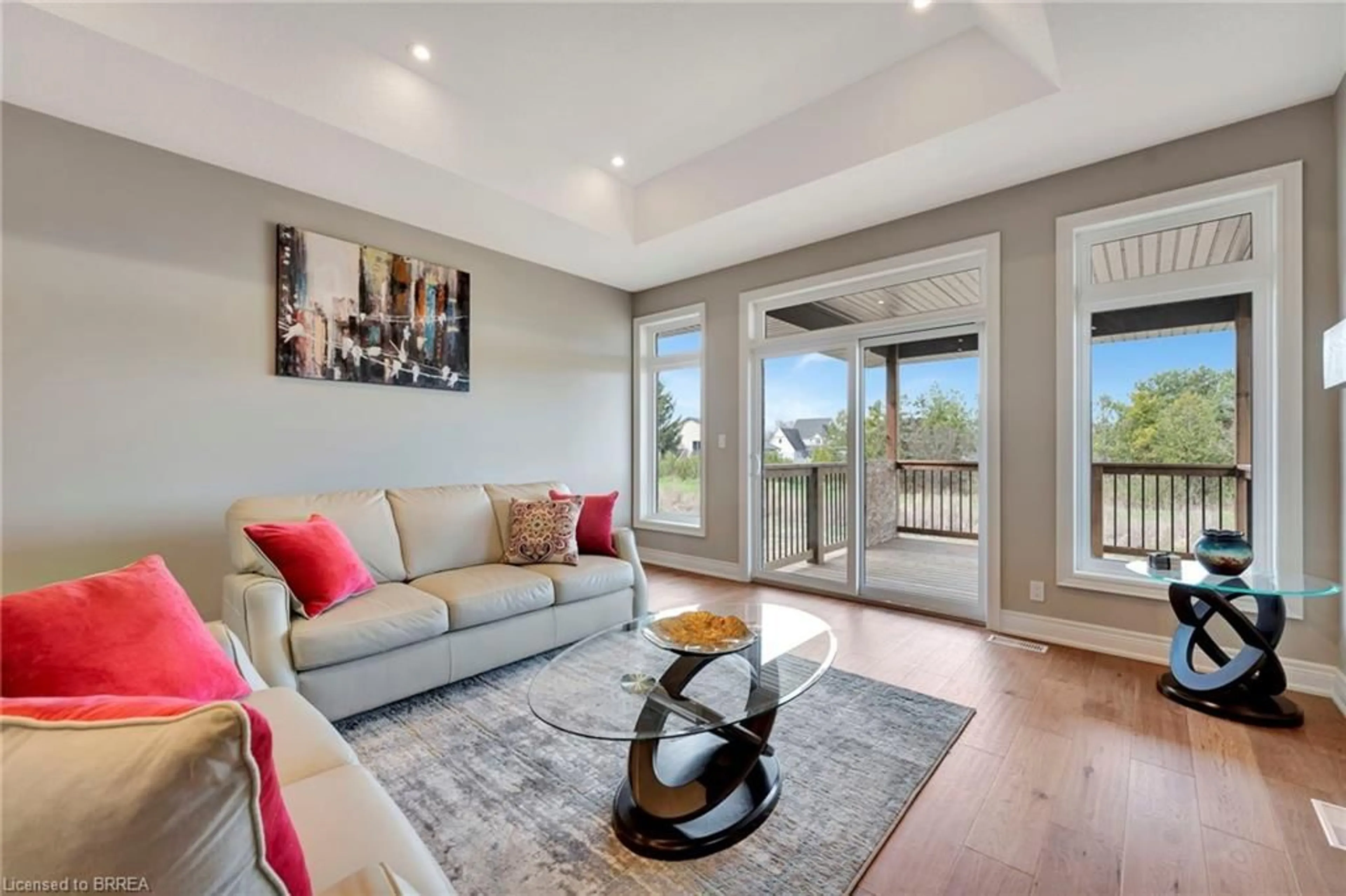 Living room with furniture, wood/laminate floor for 105 Craddock Blvd, Jarvis Ontario N0A 1J0