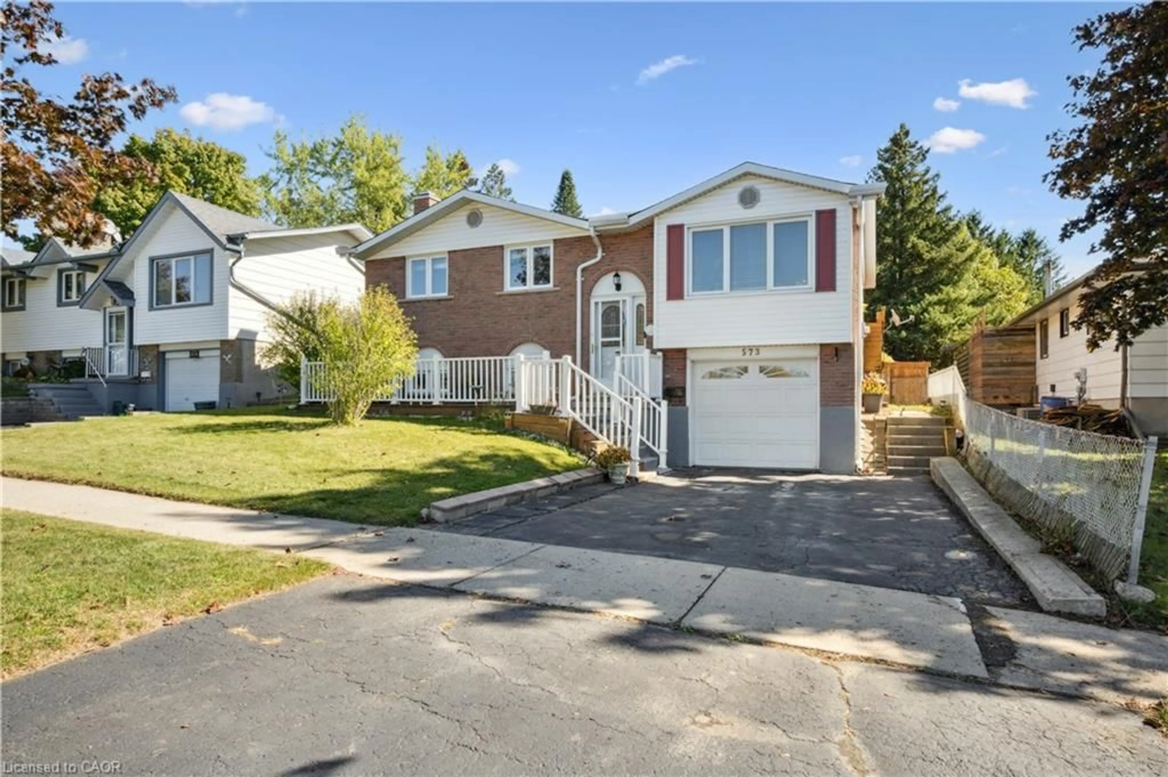Home with vinyl exterior material, street for 573 Pioneer Dr, Kitchener Ontario N2P 1P4