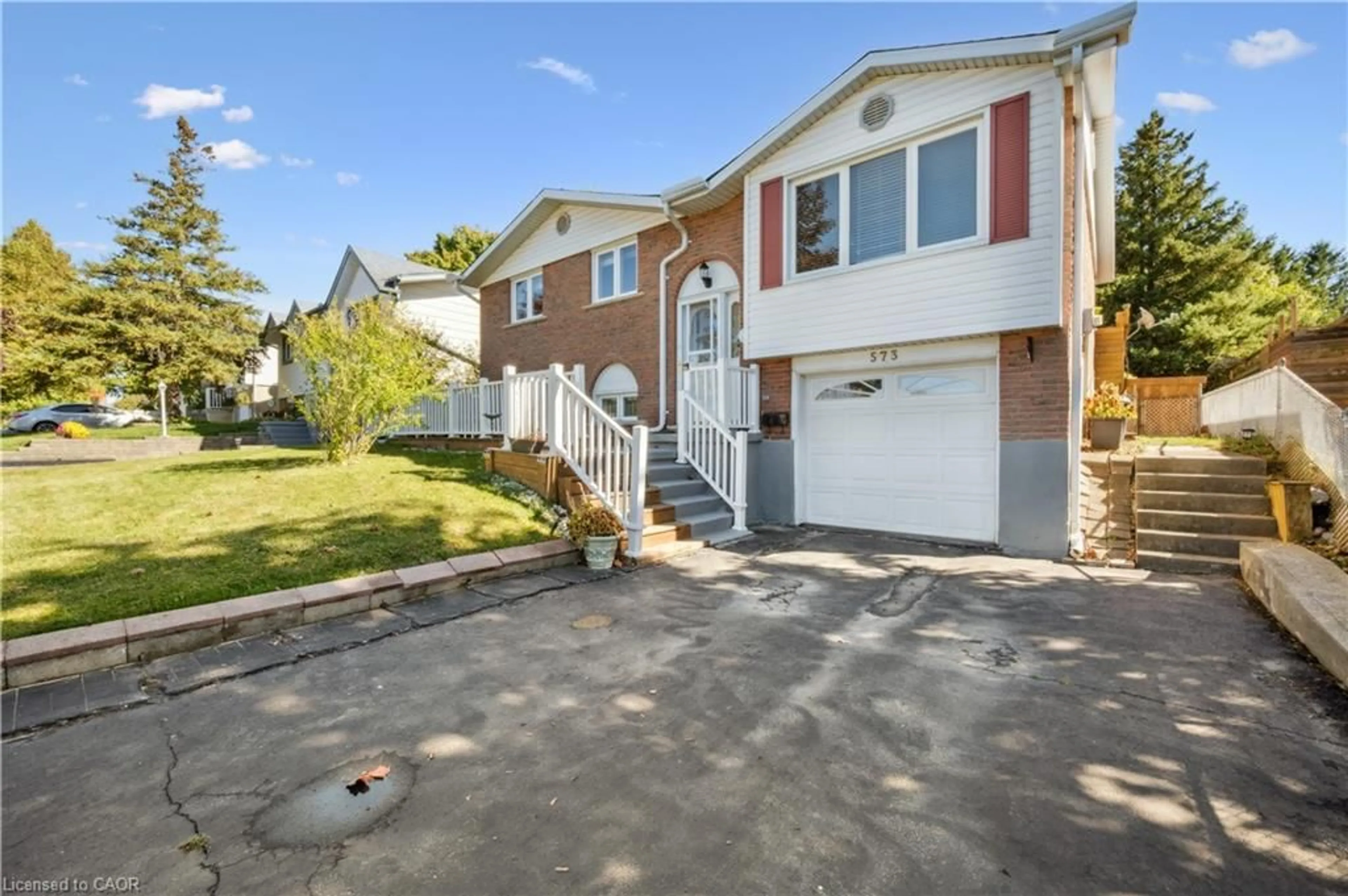 Home with vinyl exterior material, street for 573 Pioneer Dr, Kitchener Ontario N2P 1P4