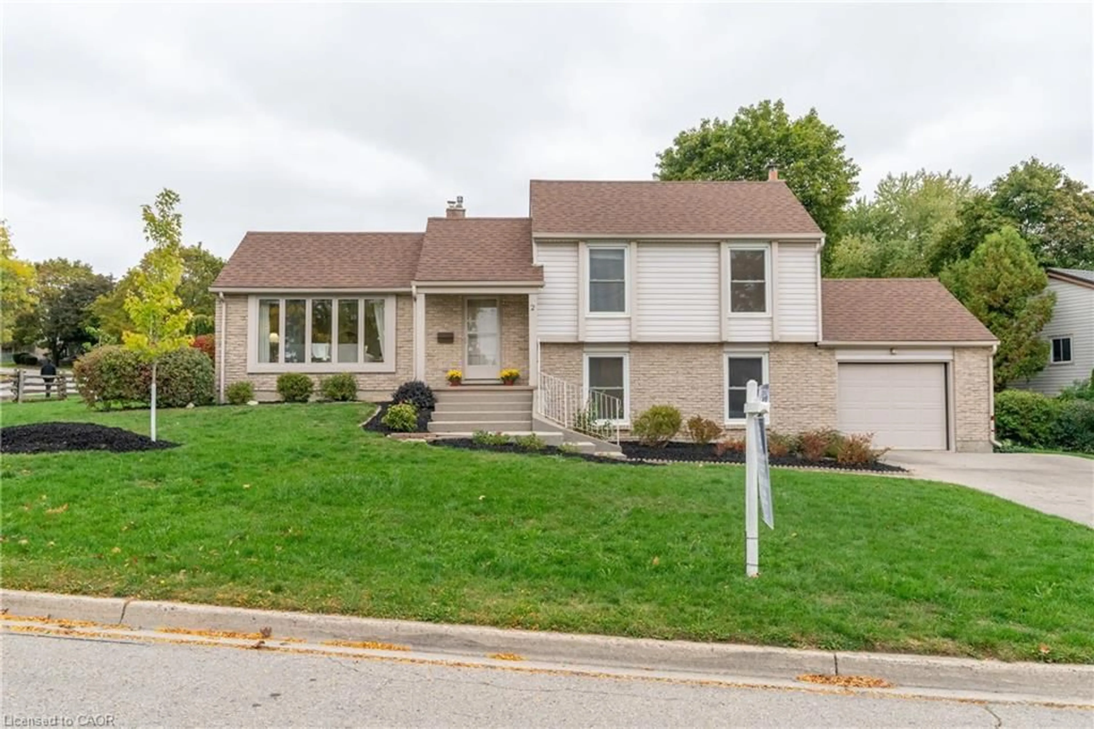 Home with vinyl exterior material, street for 2 Lisa Lane, Guelph Ontario N1H 7H7