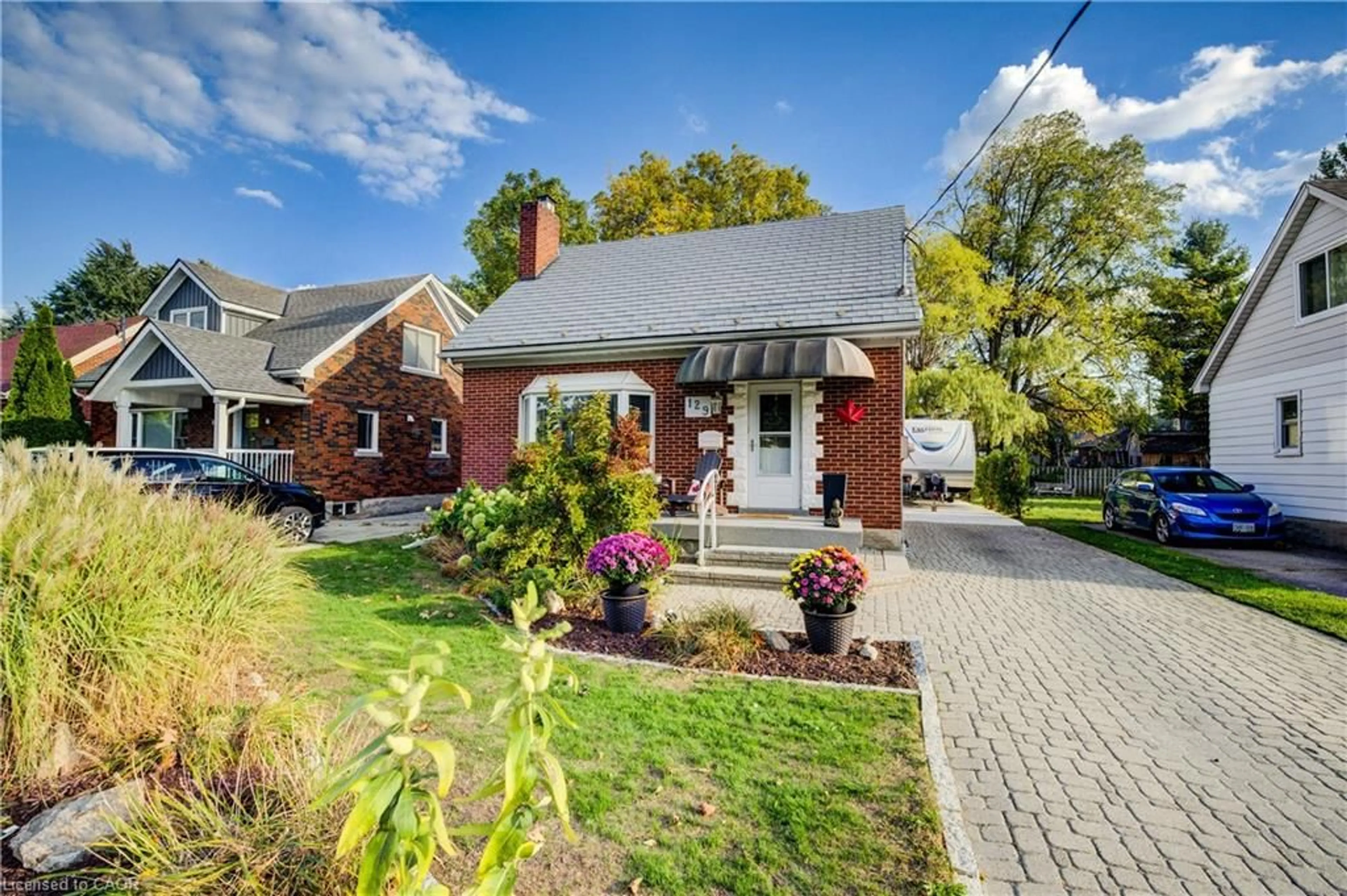 Home with brick exterior material, street for 129 Talbot St, Kitchener Ontario N2M 2B2