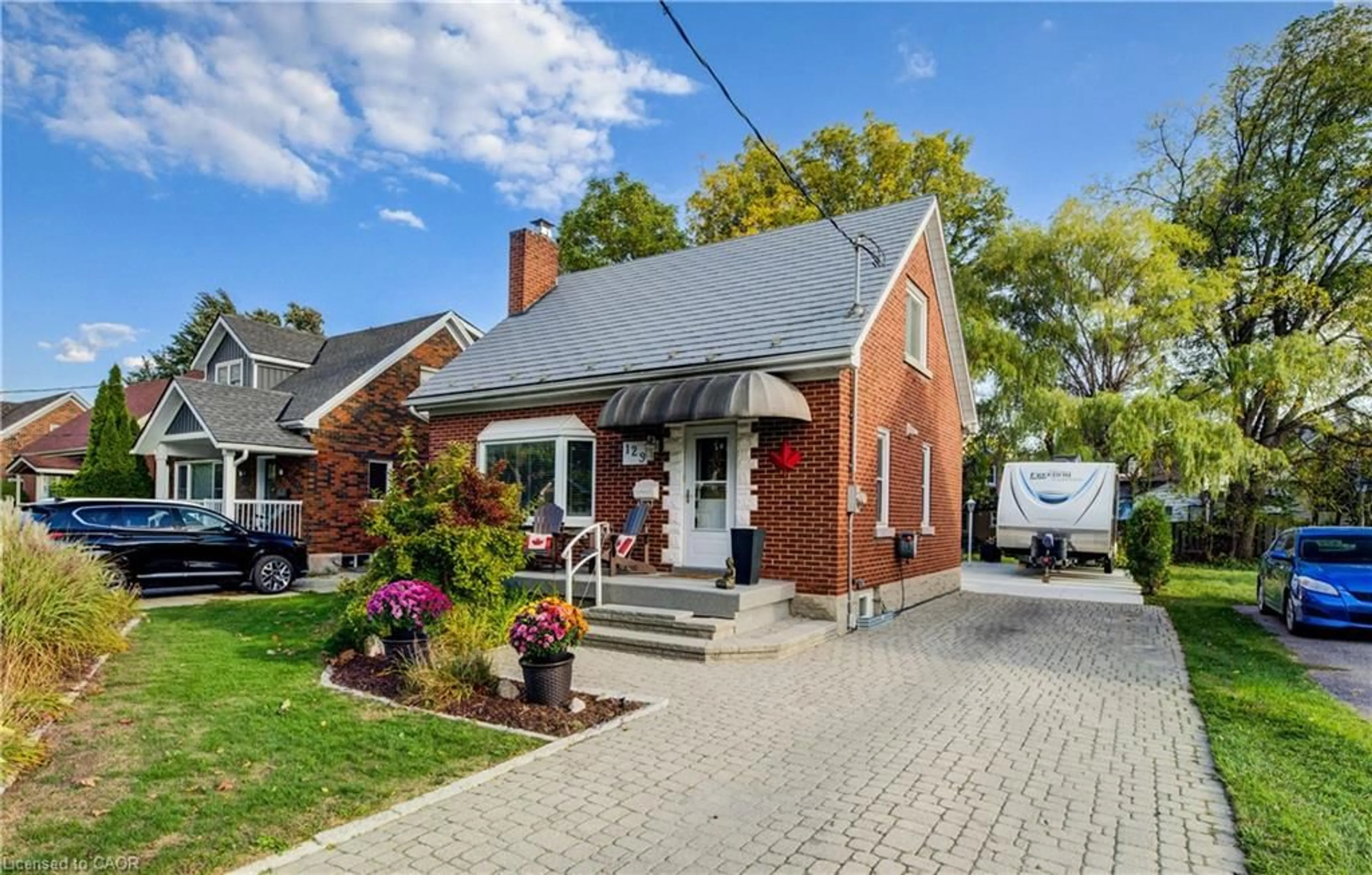 Home with brick exterior material, street for 129 Talbot St, Kitchener Ontario N2M 2B2