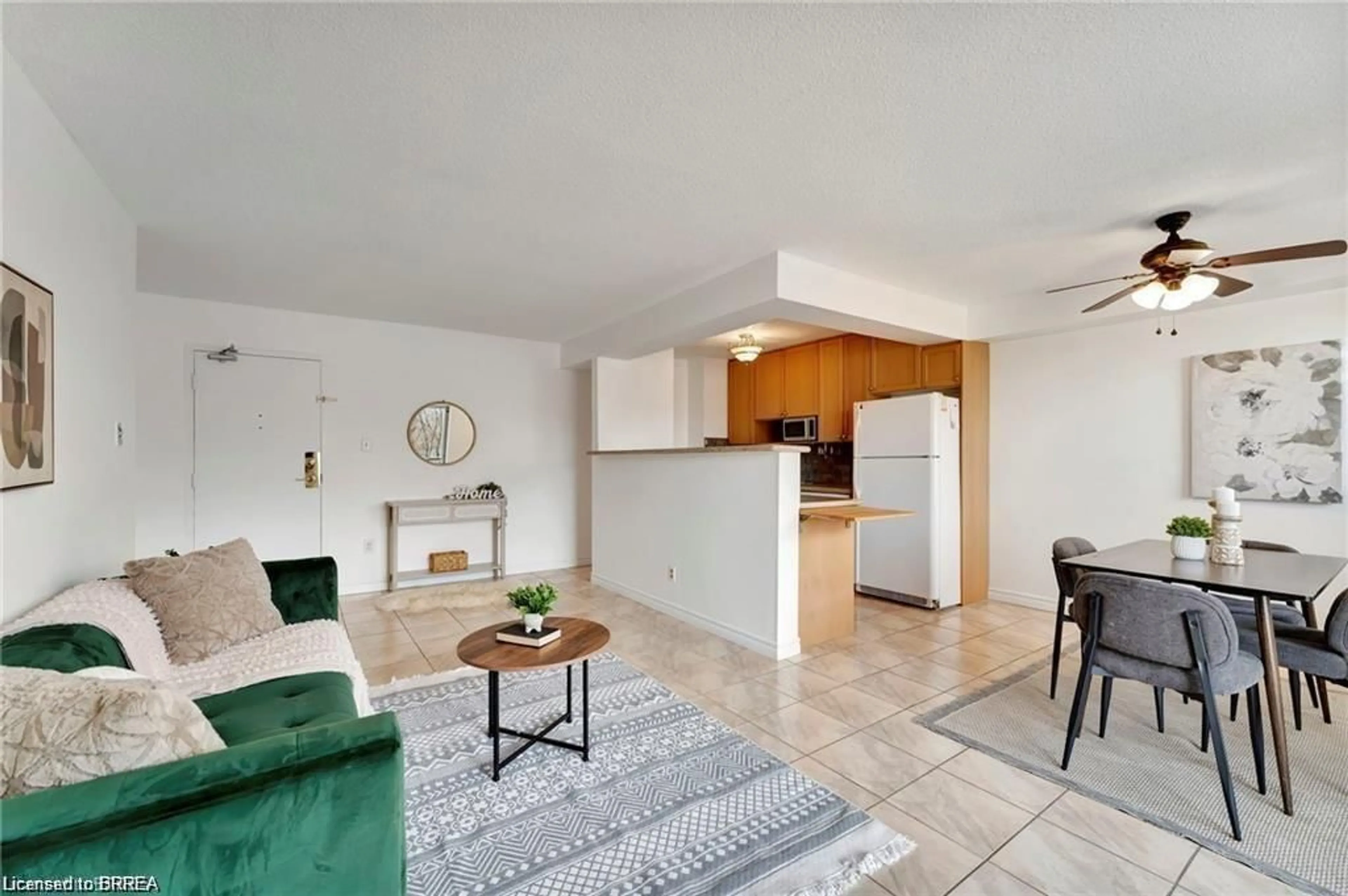 Living room with furniture, ceramic/tile floor for 793 Colborne St #207, Brantford Ontario N3S 7J3