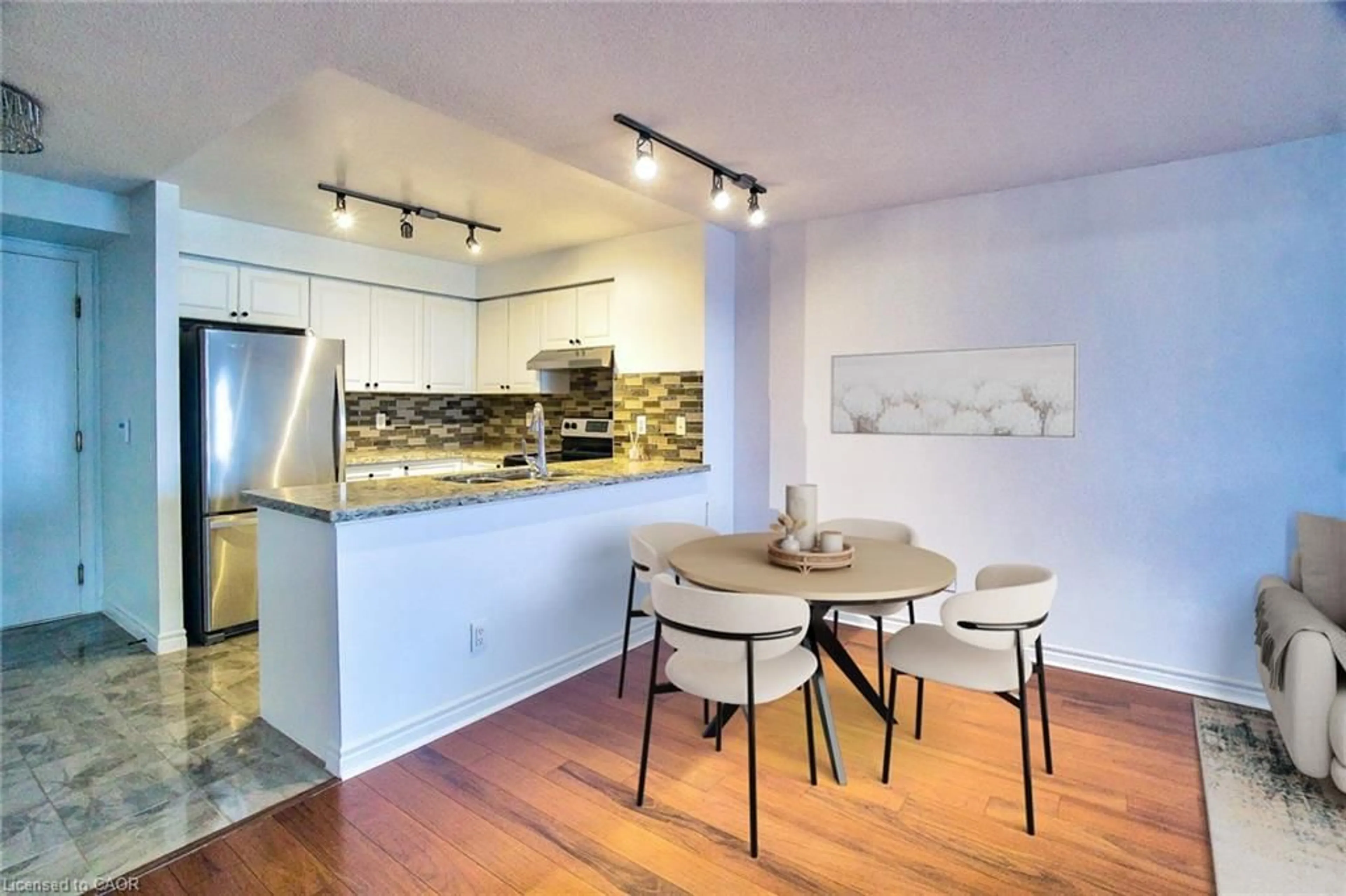 Open concept kitchen, wood/laminate floor for 25 Kingsbridge Garden Cir, Mississauga Ontario L5R 4B1