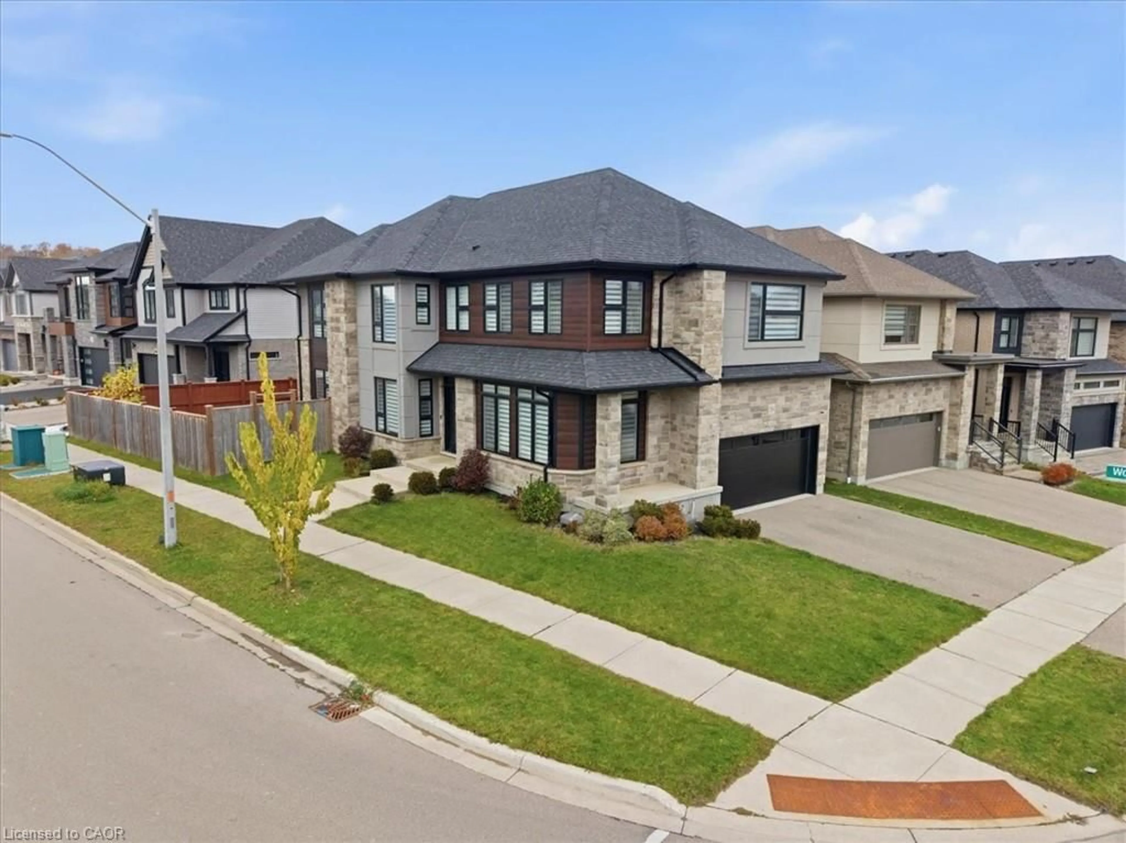 Home with brick exterior material, street for 556 Mayapple St, Waterloo Ontario N2V 0G2