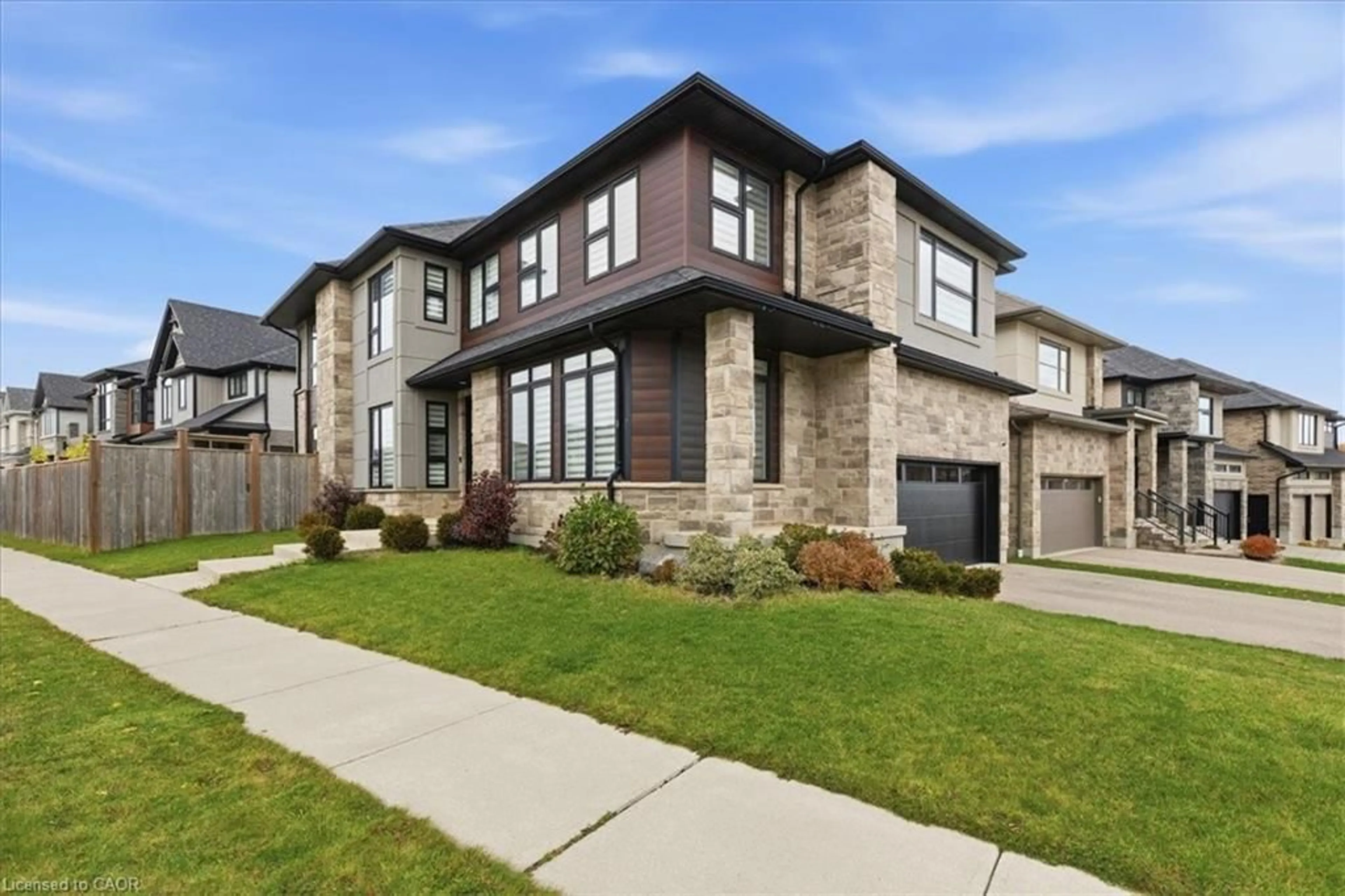 Home with brick exterior material, street for 556 Mayapple St, Waterloo Ontario N2V 0G2