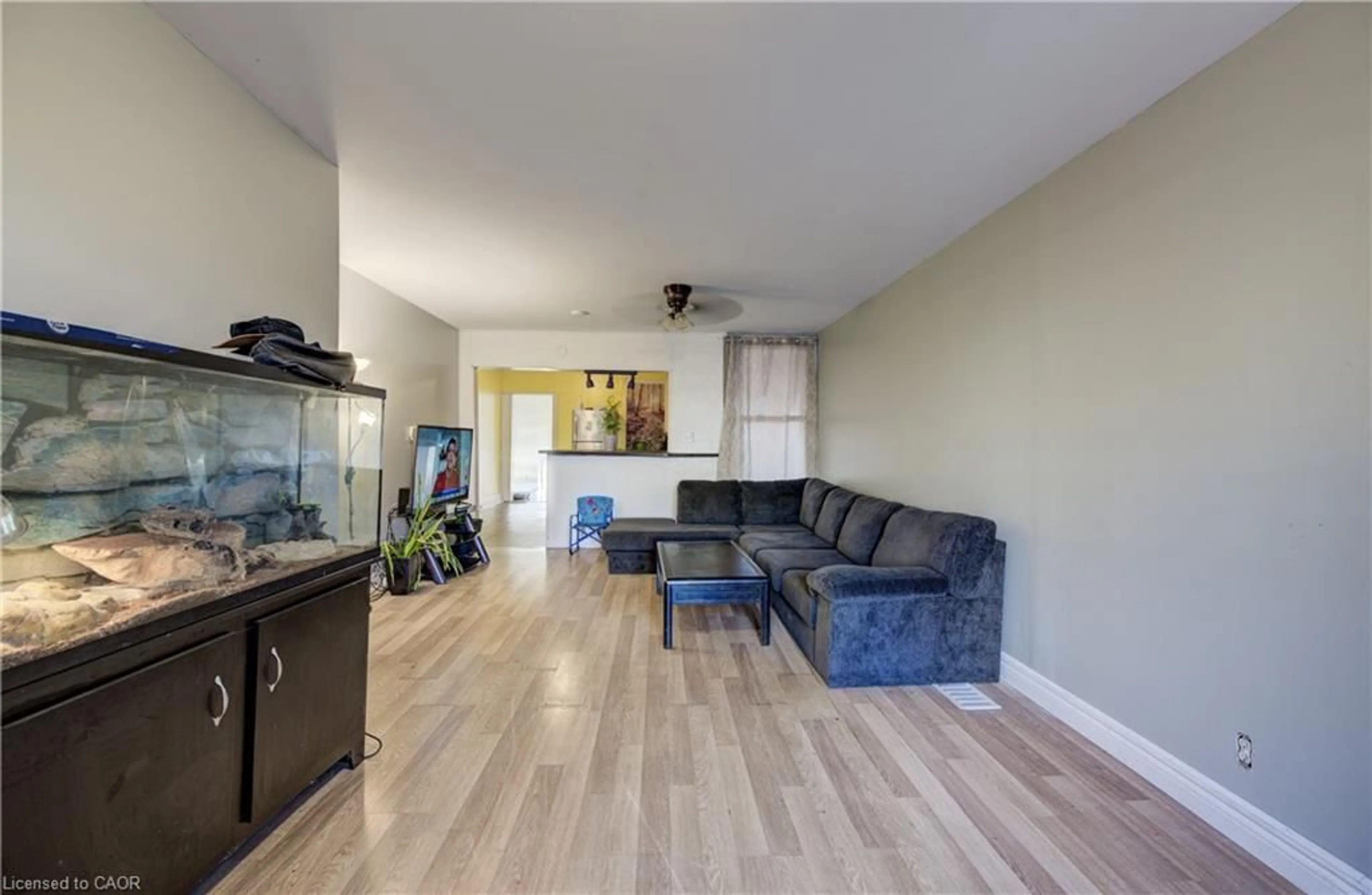 Living room with furniture, wood/laminate floor for 82 Simcoe St, Hamilton Ontario L8L 3N4