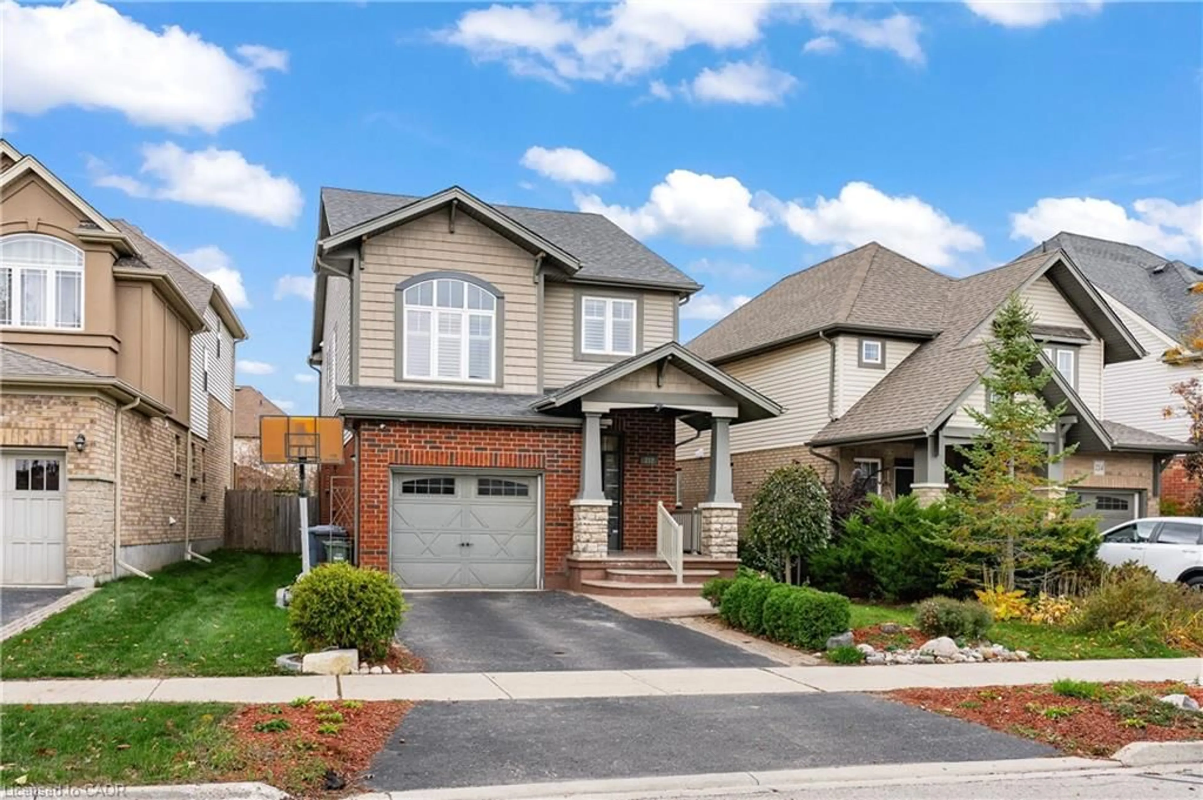 Home with brick exterior material, street for 212 Goodwin Dr, Guelph Ontario N1L 0C8