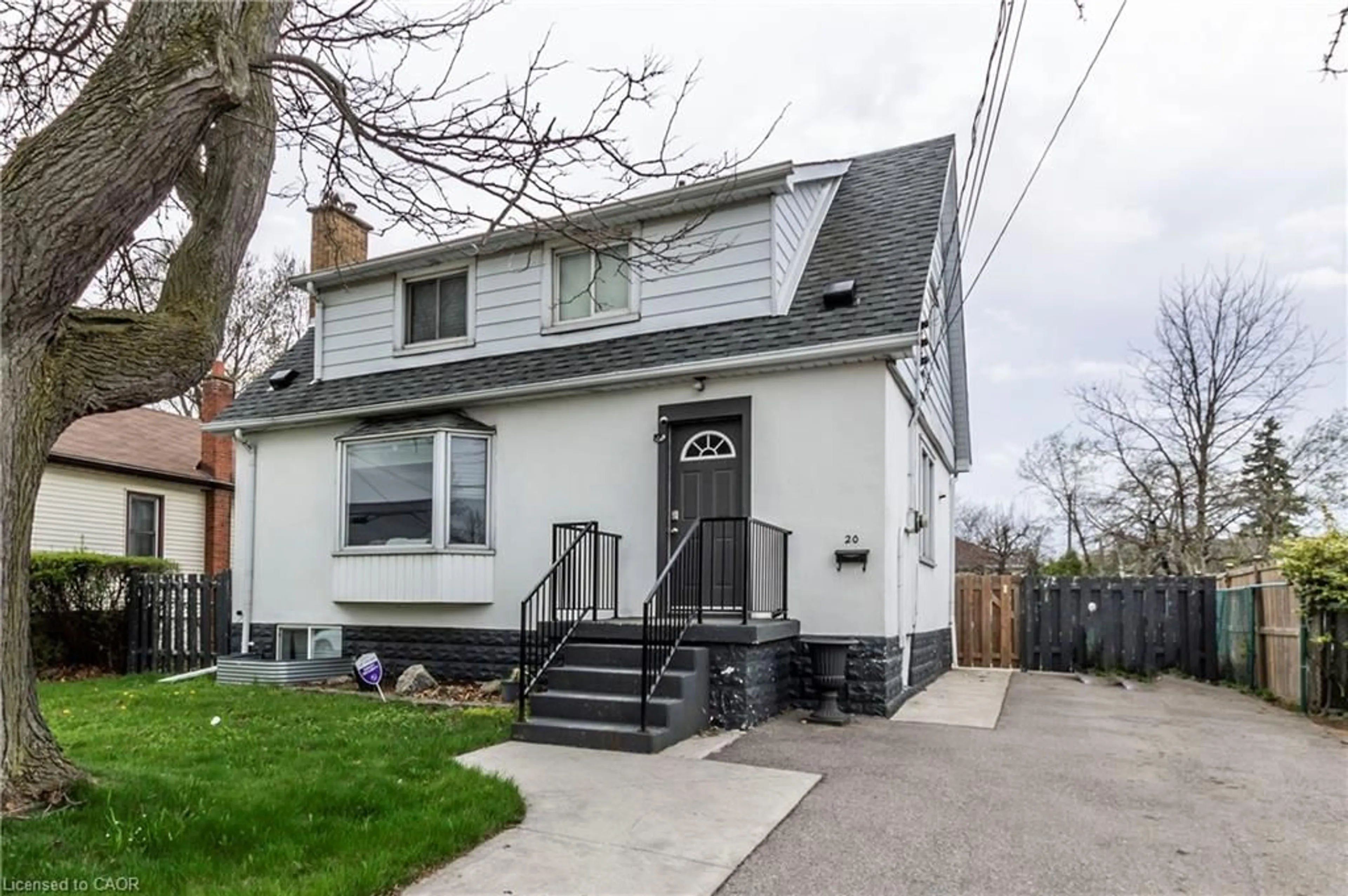 Home with vinyl exterior material, street for 20 West 1st St, Hamilton Ontario L9C 3B8