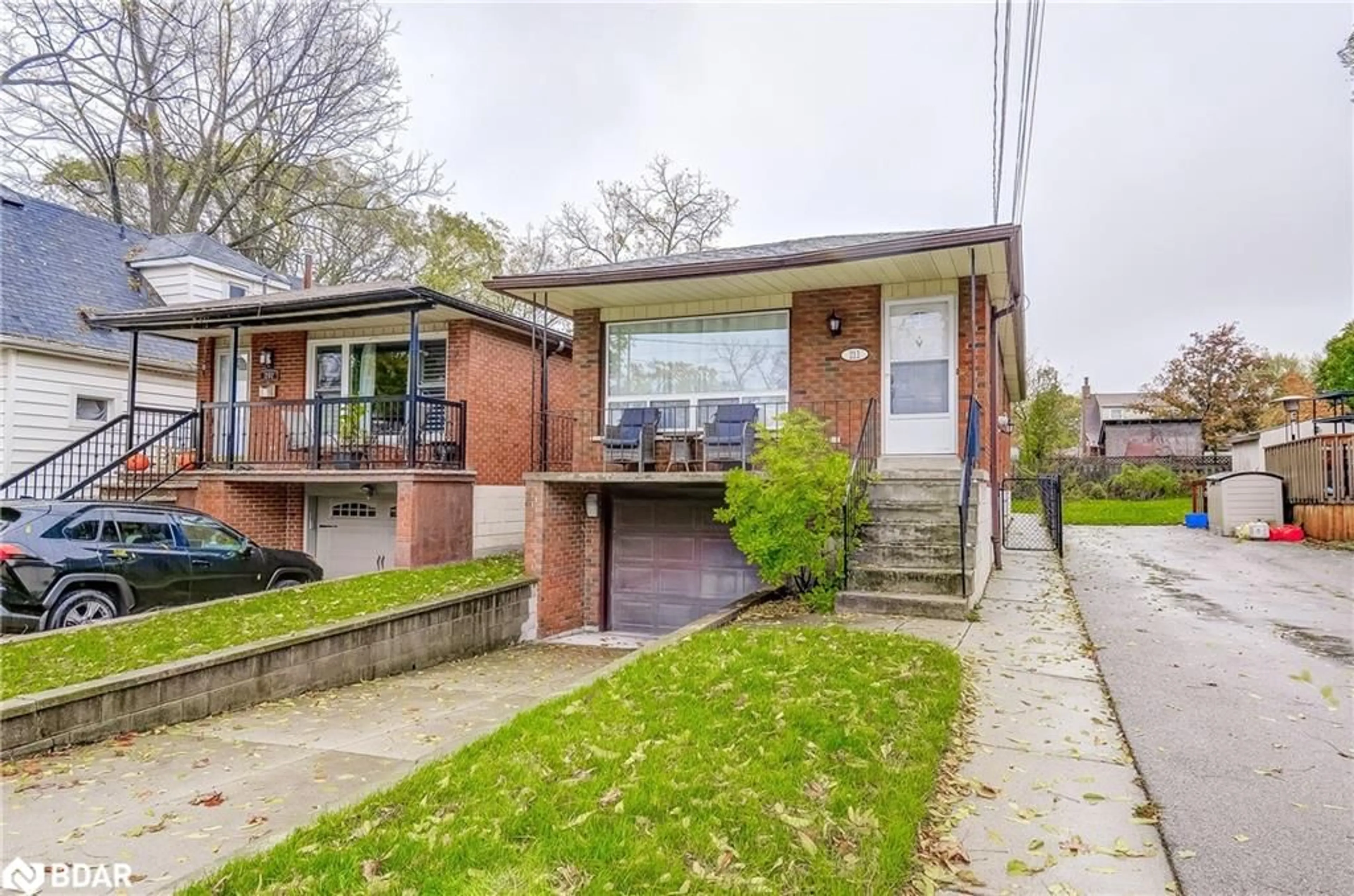 Home with brick exterior material, street for 211 East 8th St, Hamilton Ontario L9A 3L7