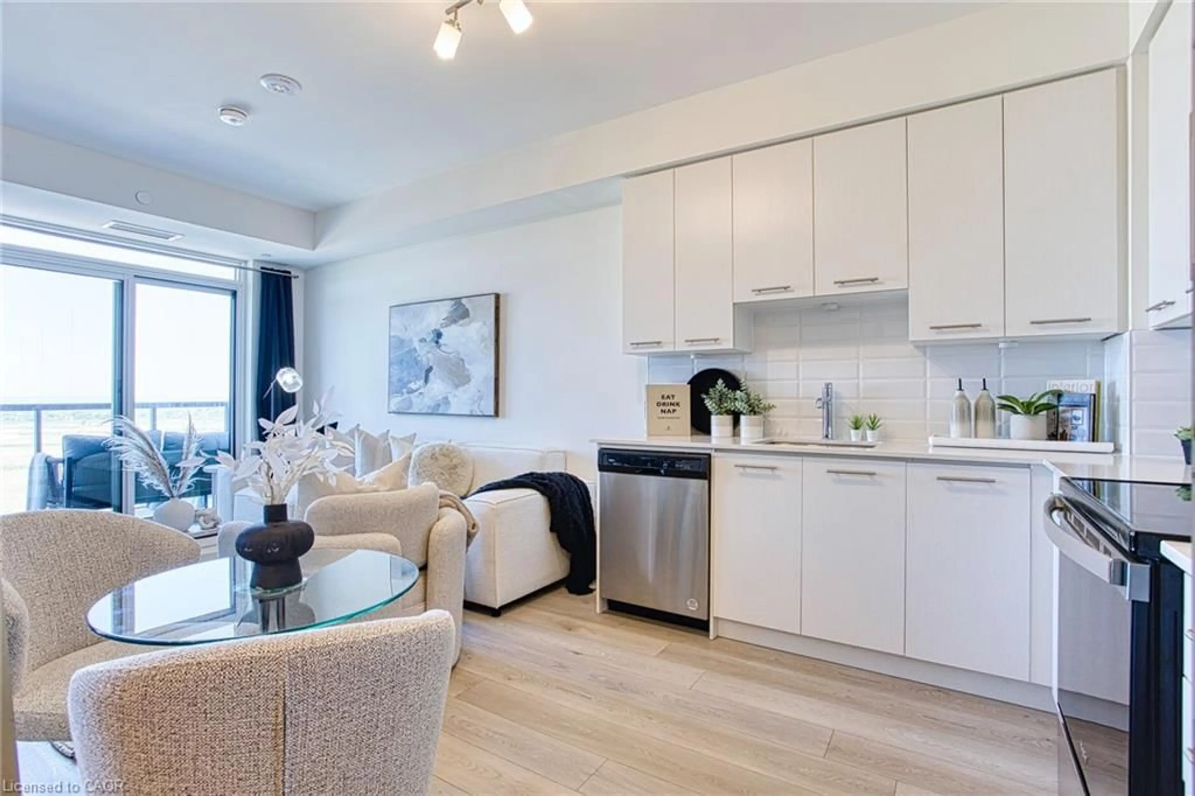 Open concept kitchen, wood/laminate floor for 385 Winston Rd #1204, Grimsby Ontario L3M 0J3